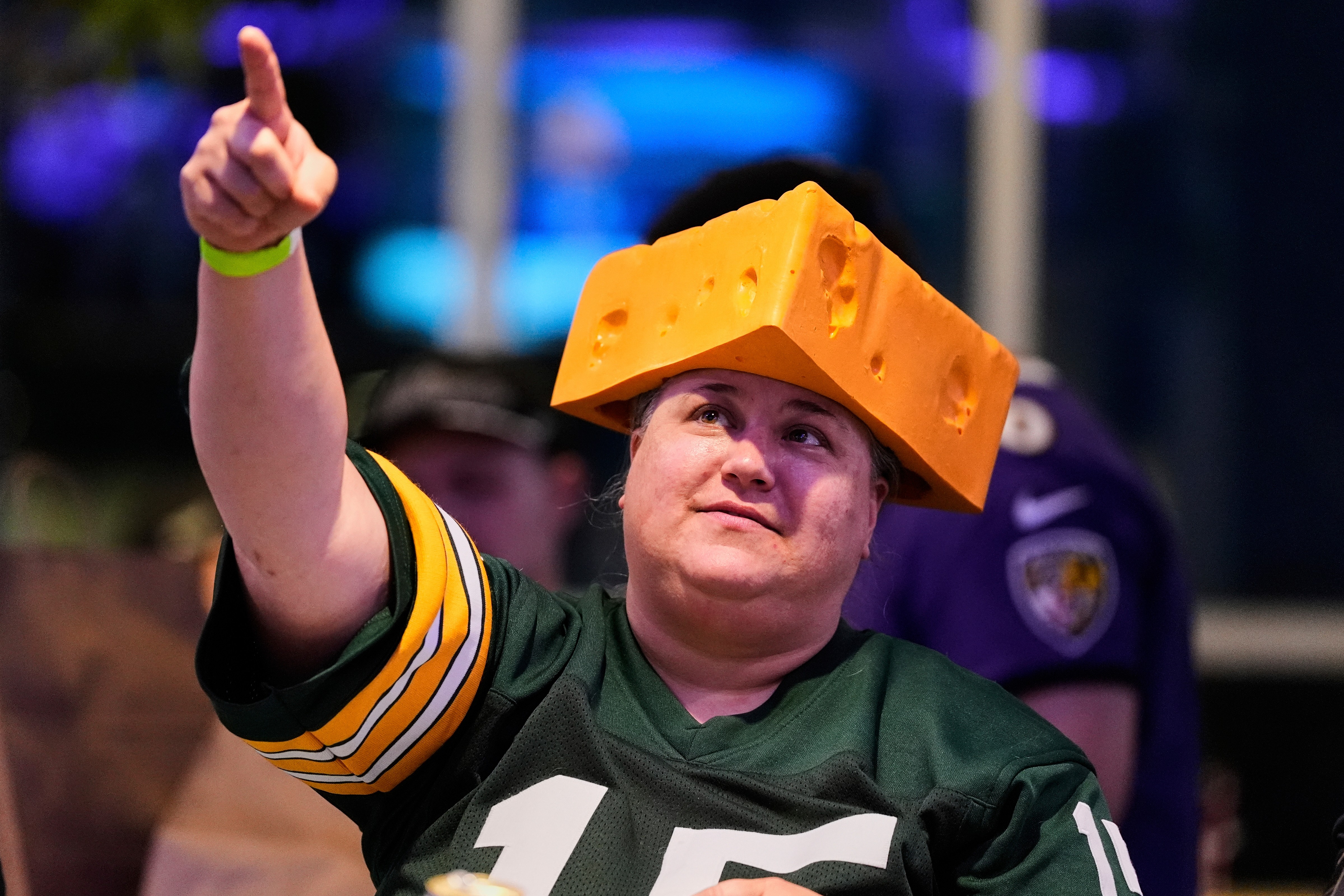 The cheesehead hat is a sunny nod to America's 'Hold my beer' exuberance