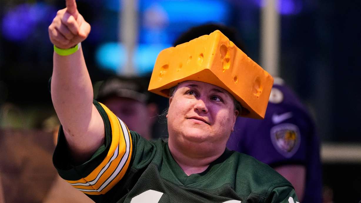 FILE - A Green Bay Packers fan wears a cheesehead hat during a Ravens football draft party at M&T Bank Stadium in Baltimore, April 24, 2025.