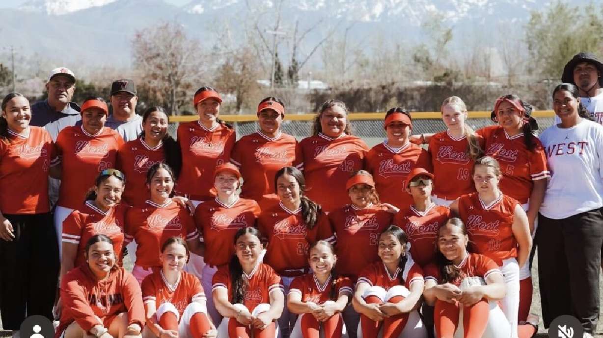 Huntyr Ava poses with her softball team. Ava played softball in high school and college. She's now preparing to represent American Samoa at the 2028 Olympic Games.