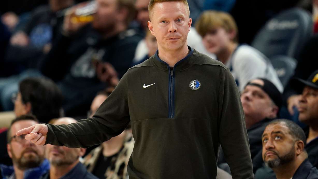 FILE - Dallas Mavericks assistant coach Sean Sweeney directs the team during the second half of an NBA basketball game against the Minnesota Timberwolves, Dec. 19, 2022, in Minneapolis.