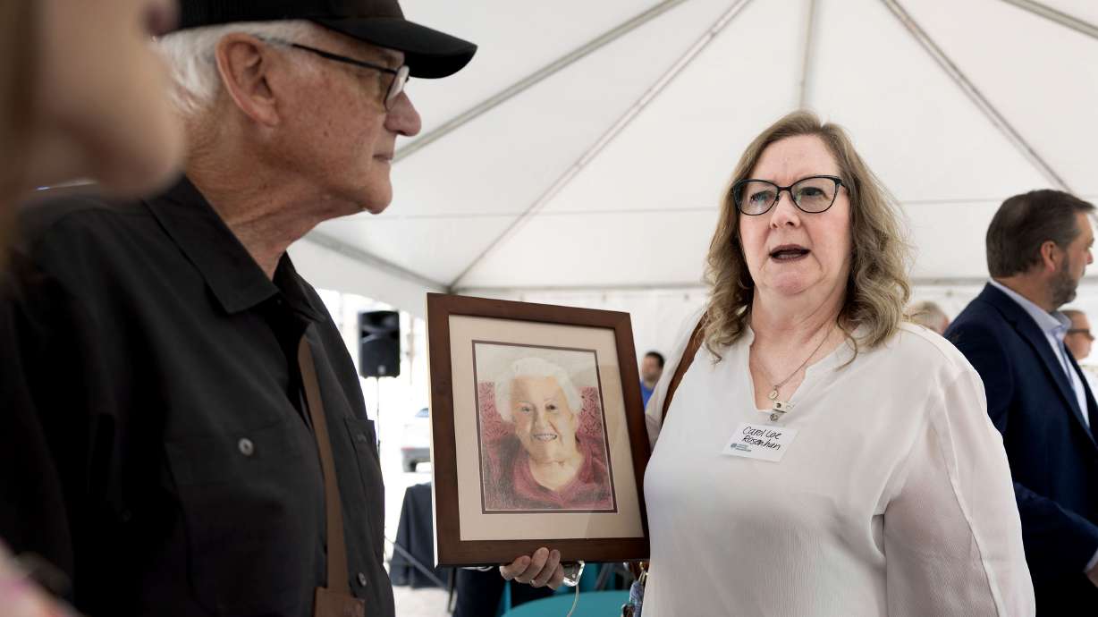 Carol Lee Rosenhaun holds a sketch of her great aunt, Erma Rosenhaun, at the a groundbreaking ceremony for Erma’s at Fairmont, a new 110-unit affordable housing community for seniors in Salt Lake City on Friday.