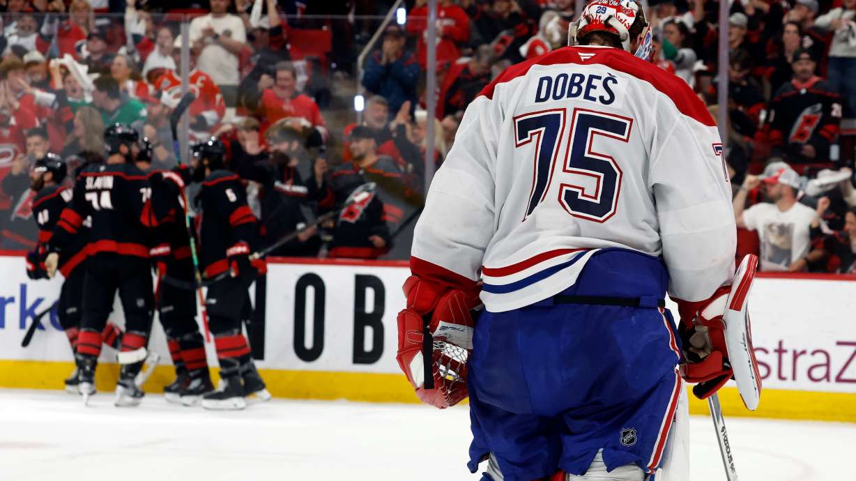 Carolina Hurricanes players celebrate after a goal by Nikolaj Ehlers as Montreal Canadiens goaltender Jakub Dobes (75) returns to the net during the second period in Game 2 of the Eastern Conference final NHL hockey Stanley Cup playoff series in Raleigh, N.C., Saturday, May 23, 2026.