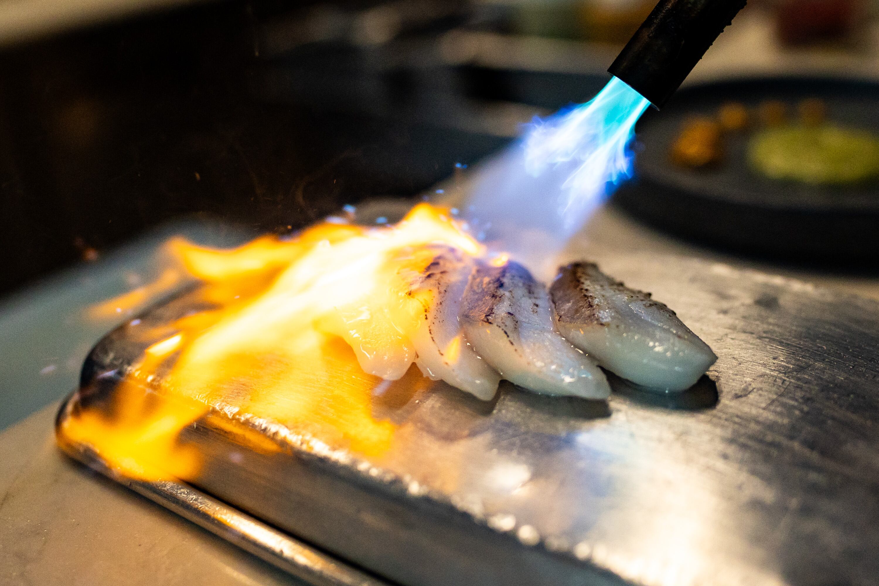 Chef Travis Herbert, finalist for the James Beard Awards, prepares torched sablefish at his restaurant Felt Bar and Eatery in Salt Lake City on Thursday. The restaurant has only been open for two years, but has already gained recognition.