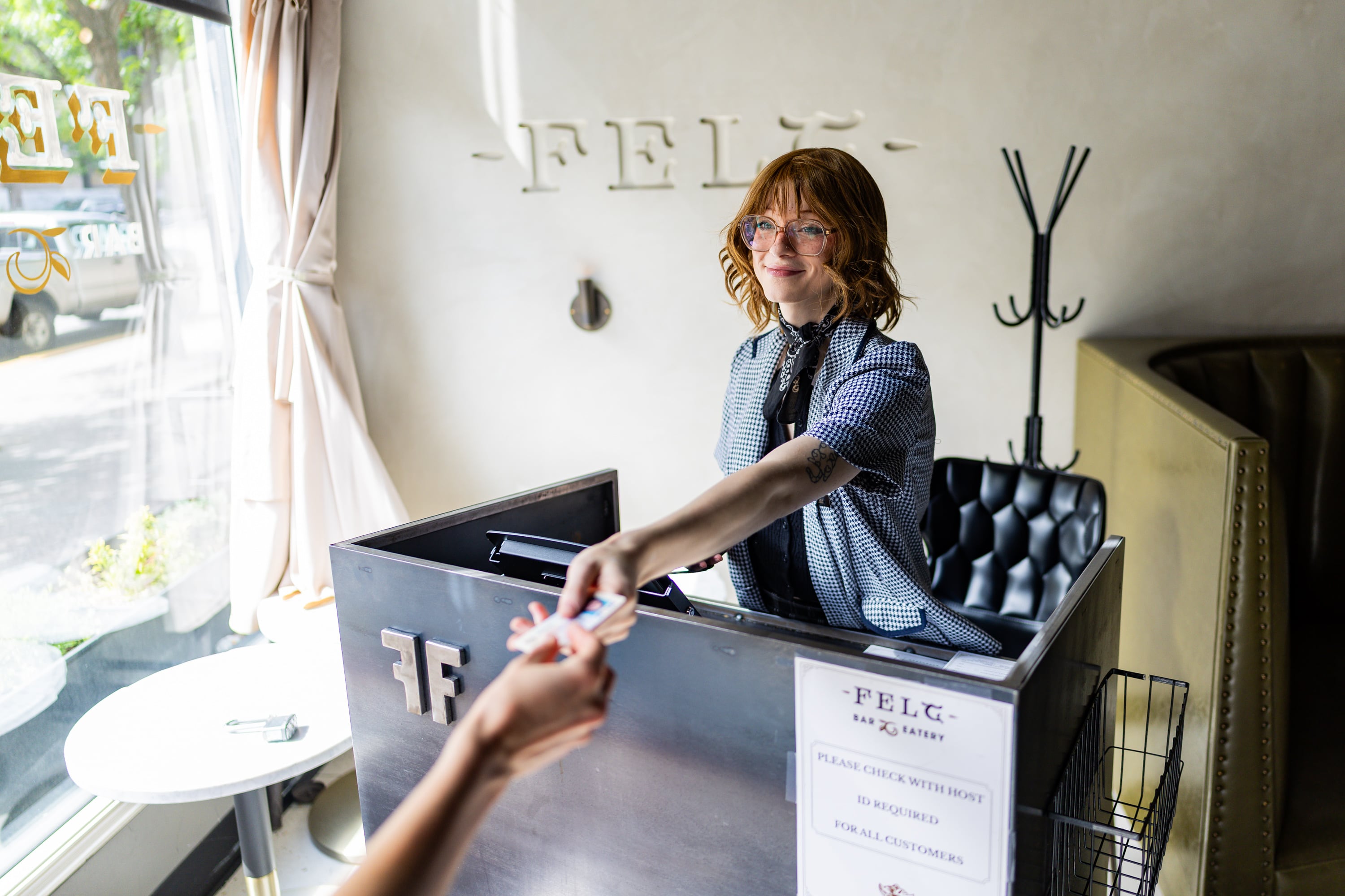 Clair Taylor, front house manager, greets a person entering Felt Bar and Eatery in Salt Lake City on Thursday. Chef Travis Herbert said he is proud to be a part of the rising culinary scene in Utah.