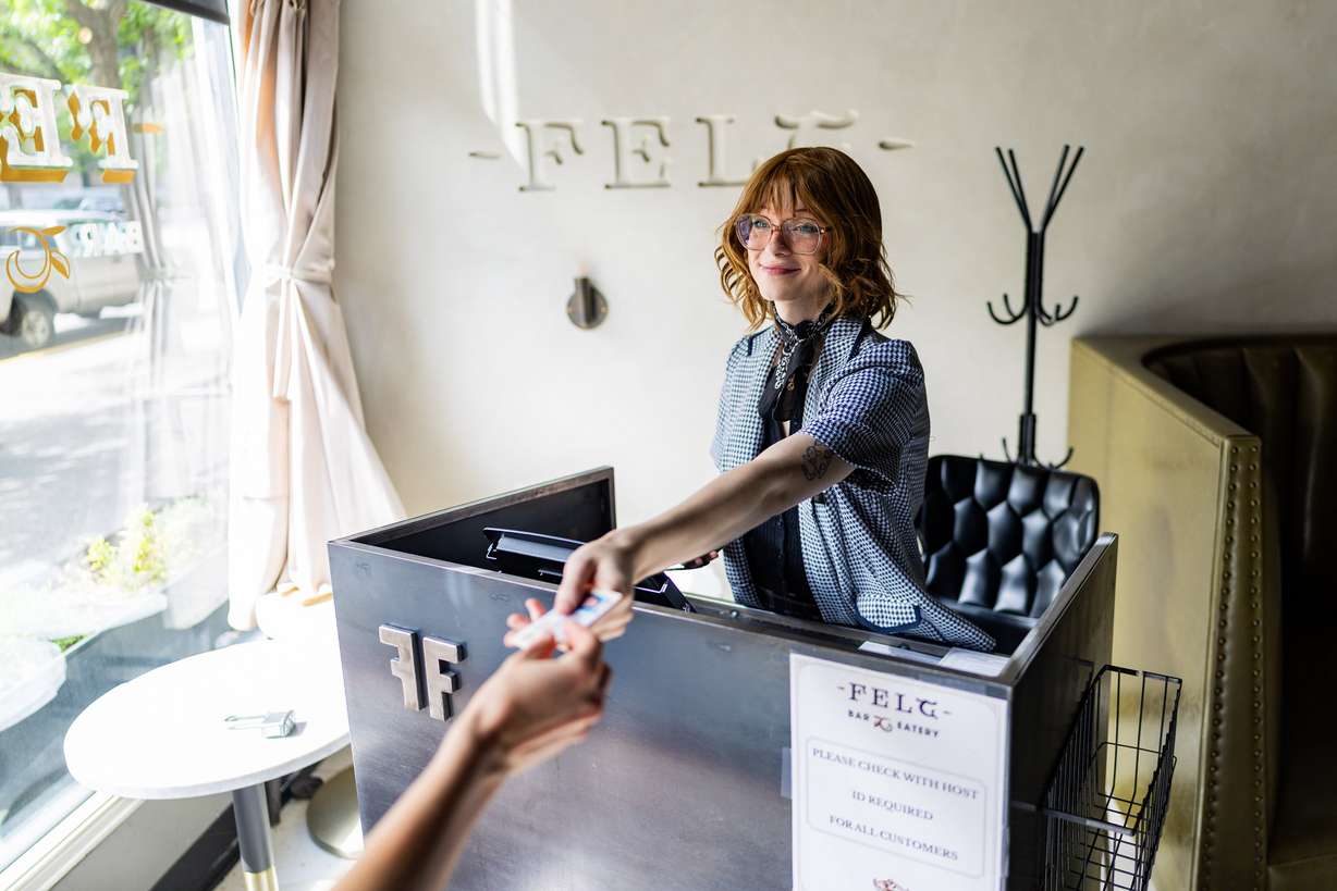 Clair Taylor, front house manager, greets a person entering Felt Bar and Eatery in Salt Lake City on Thursday. Chef Travis Herbert said he is proud to be a part of the rising culinary scene in Utah.