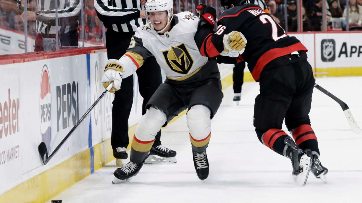 FILE - Vegas Golden Knights right wing Pavel Dorofeyev (16) and Carolina Hurricanes defenseman Sean Walker (26) vie for the puck during the first period of an NHL hockey game Oct. 28, 2025, in Raleigh, N.C.