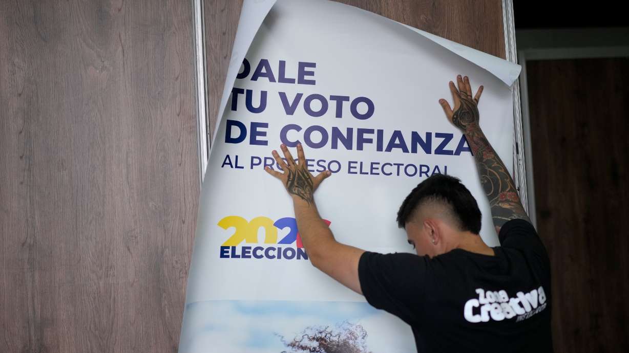 An electoral worker sets up a voting center in preparation for Sunday's presidential election in Bogota, Colombia, Friday.