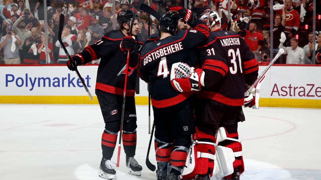 Carolina Hurricanes players join goaltender Frederik Andersen (31) following Game 5 of the Eastern Conference finals NHL hockey Stanley Cup playoff series against the Montreal Canadiens in Raleigh, N.C., Friday, May 29, 2026.