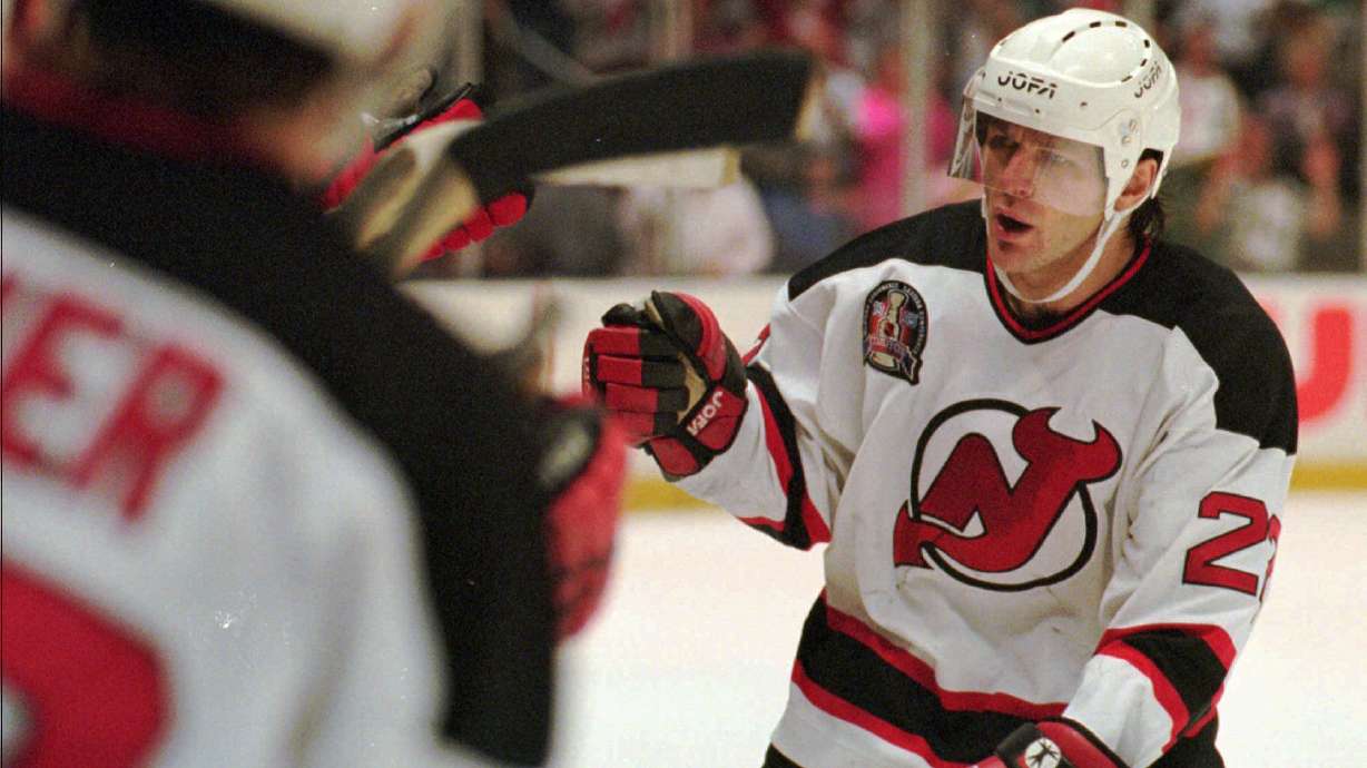 FILE - New Jersey Devils Claude Lemieux is greeted at the bench after scoring a goal in the first period of Game 3 of the NHL Stanley Cup Finals against the Detroit Redwings Thursday, June 22, 1995 at the Meadowlands in East Rutherford, N.J.