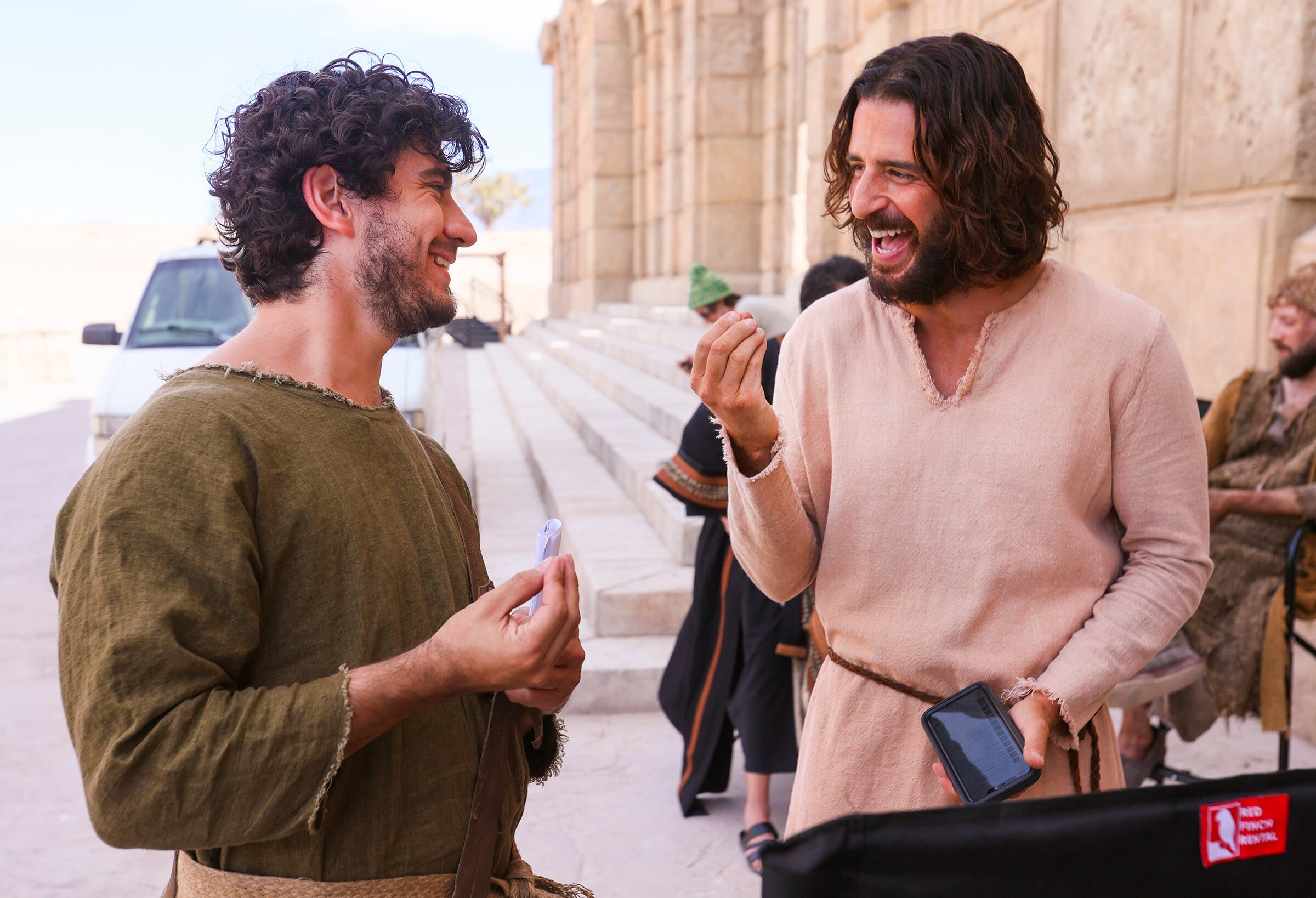 George Harrison Xanthis, who plays John, laughs with Jonathan Roumie, who plays Jesus, during a pause in filming of a faith-based streaming series on the life of Christ called "The Chosen" at The Church of Jesus Christ of Latter-day Saints' Jerusalem set in Goshen, Utah County, on Oct. 19, 2020.