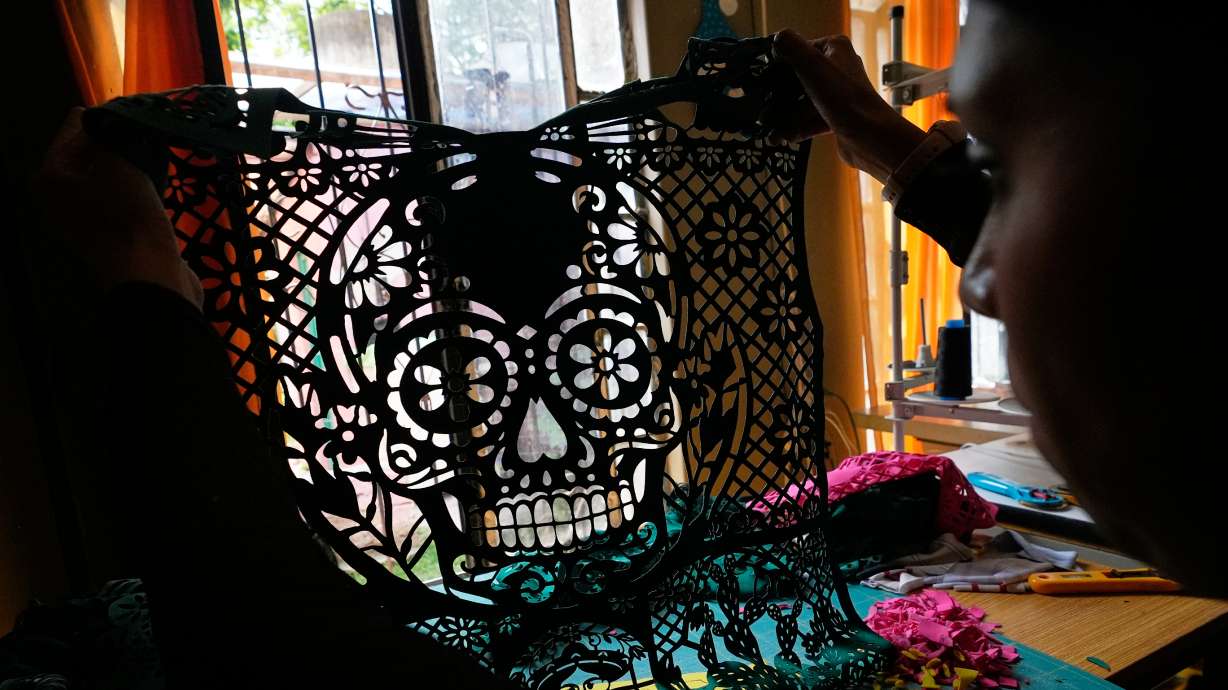 Cande Martinez prepares soccer jerseys, inspired by papel picado and traditional folk art, from the brand Mexclart, in Cuautitlán Izcalli, Mexico, Monday, May 25, 2026.