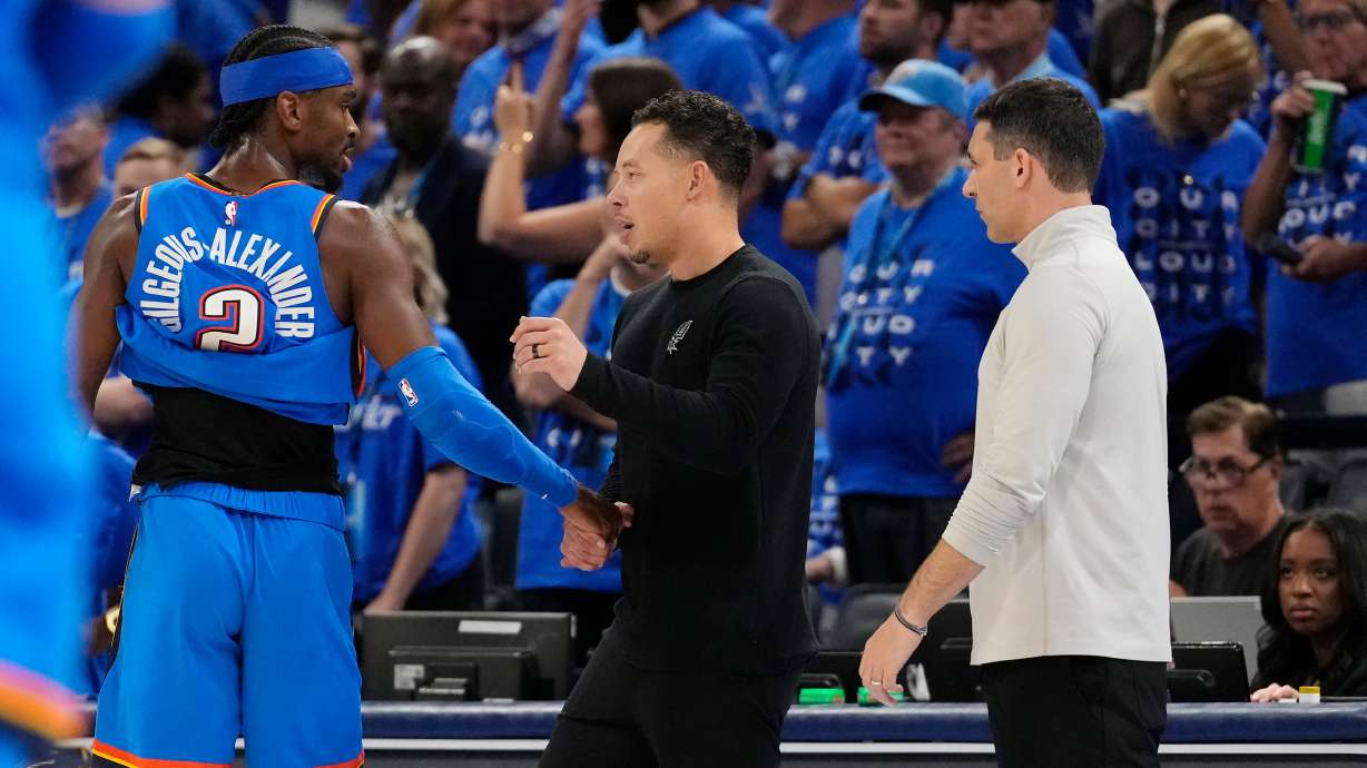 San Antonio Spurs head coach Mitch Johnson, center, talks with Oklahoma City Thunder guard Shai Gilgeous-Alexander (2) as Thunder head coach Mark Daigneault looks on during the second half of Game 7 of the Western Conference finals of the NBA basketball playoffs series Saturday, May 30, 2026, in Oklahoma City.