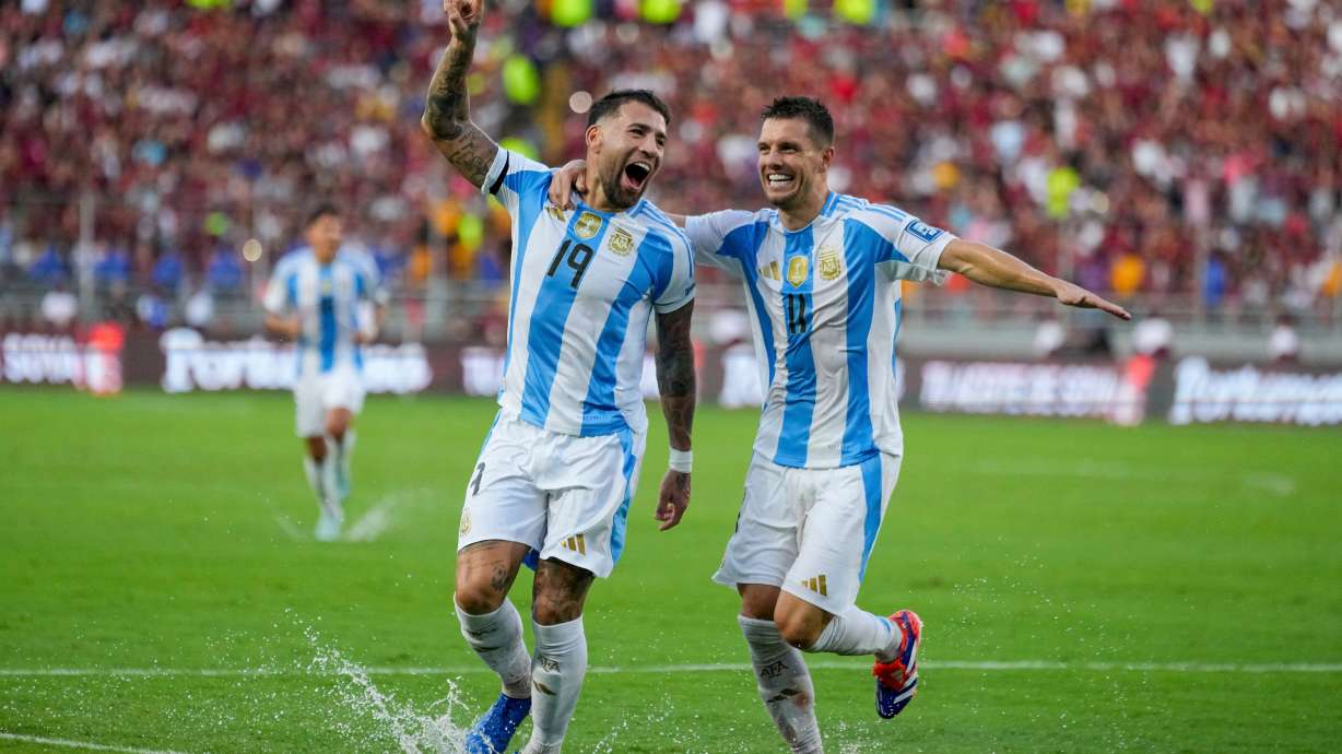 FILE - Argentina's Nicolas Otamendi (19, File) celebrates with Giovani Lo Celso after scoring his side's opening goal against Venezuela during a FIFA World Cup 2026 qualifying soccer match in Maturin, Venezuela, Thursday, Oct. 10, 2024.