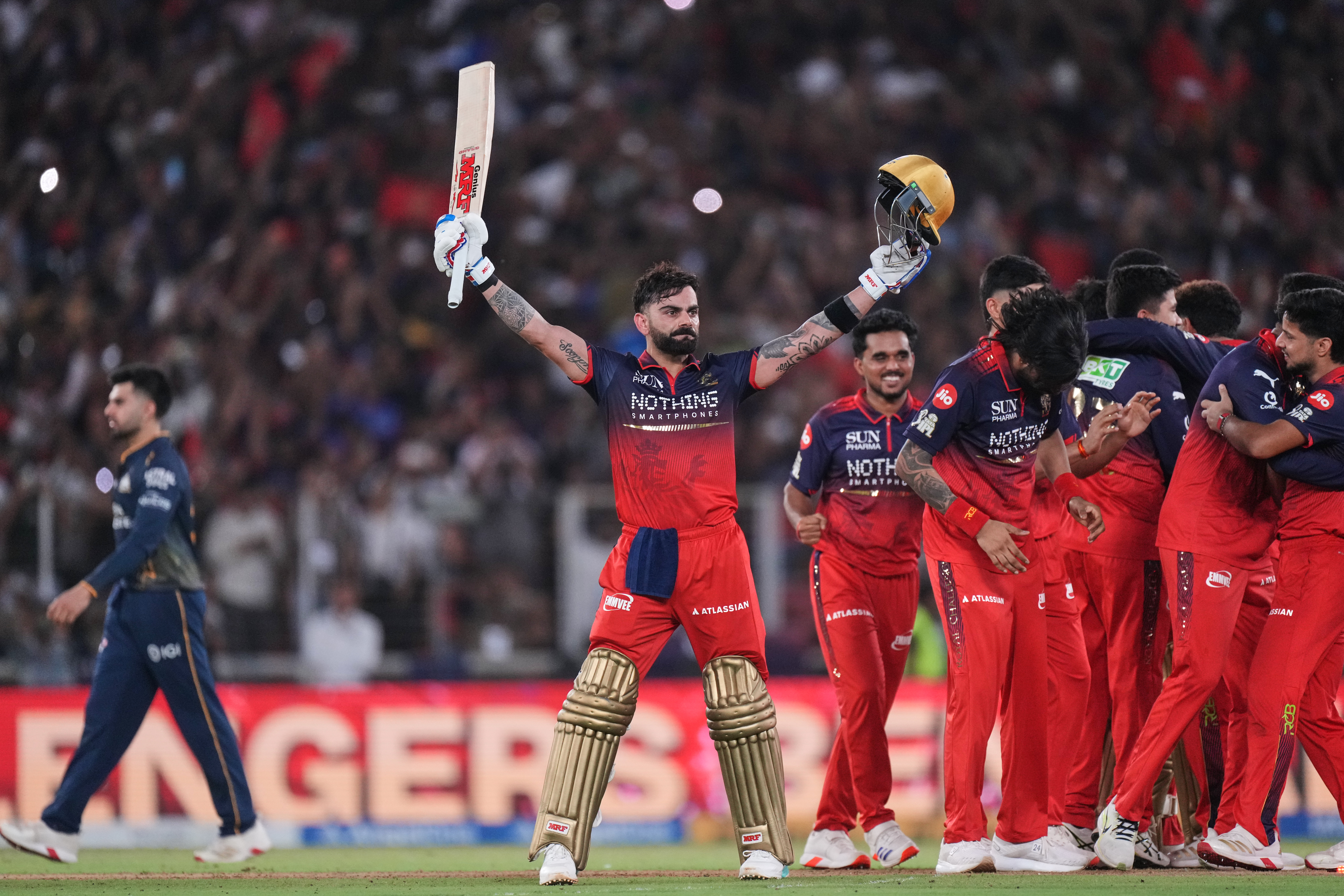Royal Challengers Bengaluru's Virat Kohli celebrates with teammates after their win in the Indian Premier League final cricket match against Gujarat Titans in Ahmedabad, India, Sunday, May 31, 2026. 