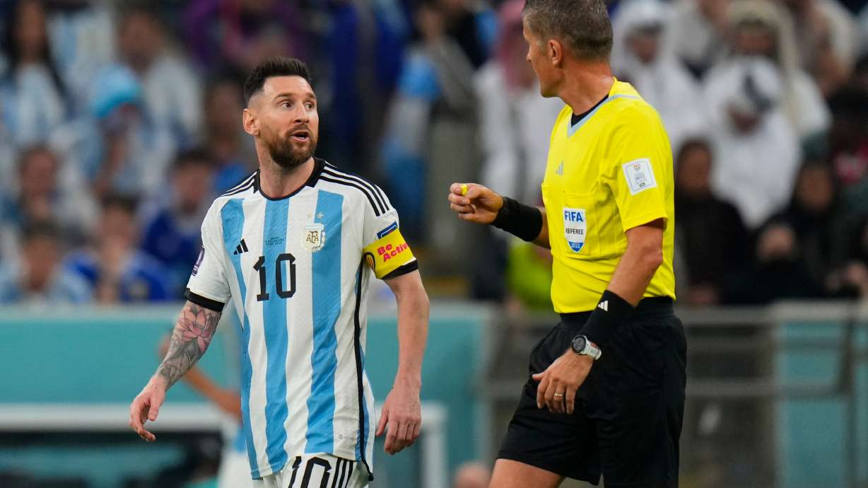 FILE - Referee Daniele Orsato talks to Argentina's Lionel Messi, left, during the World Cup semifinal soccer match between Argentina and Croatia at the Lusail Stadium in Lusail, Qatar, Dec. 13, 2022.