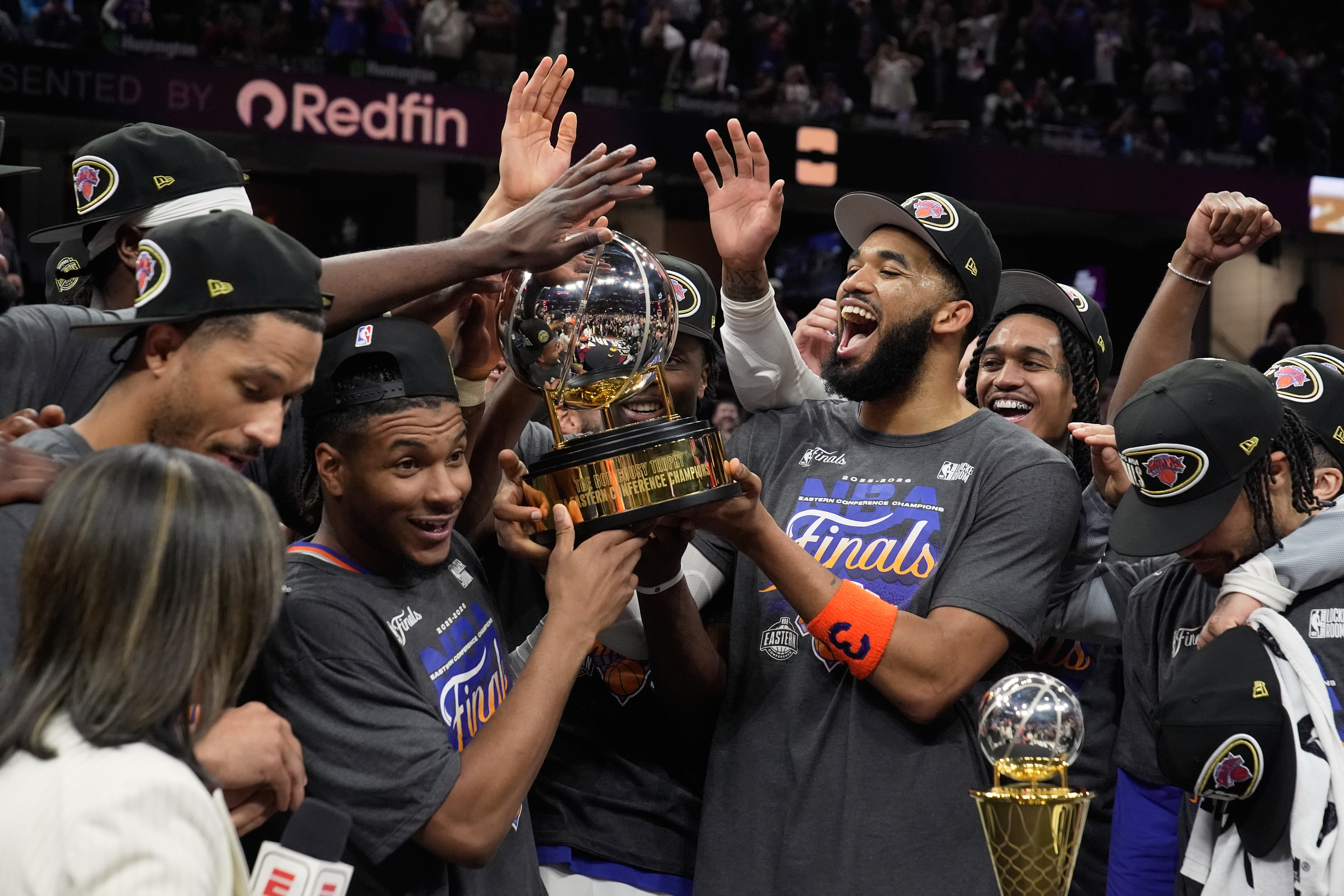 The New York Knicks hold the Eastern Conference Championship trophy after Game 4 in the Eastern Conference finals NBA basketball playoffs series against the Cleveland Cavaliers in Cleveland, Monday, May 25, 2026. 