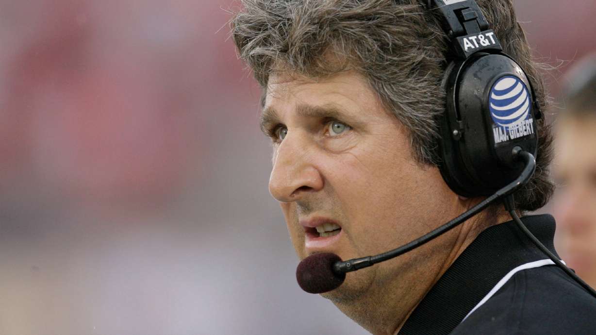 FILE - Texas Tech head coach Mike Leach looks at the scoreboard during the first quarter of a football game against SMU, Sept. 3, 2007, in Dallas.