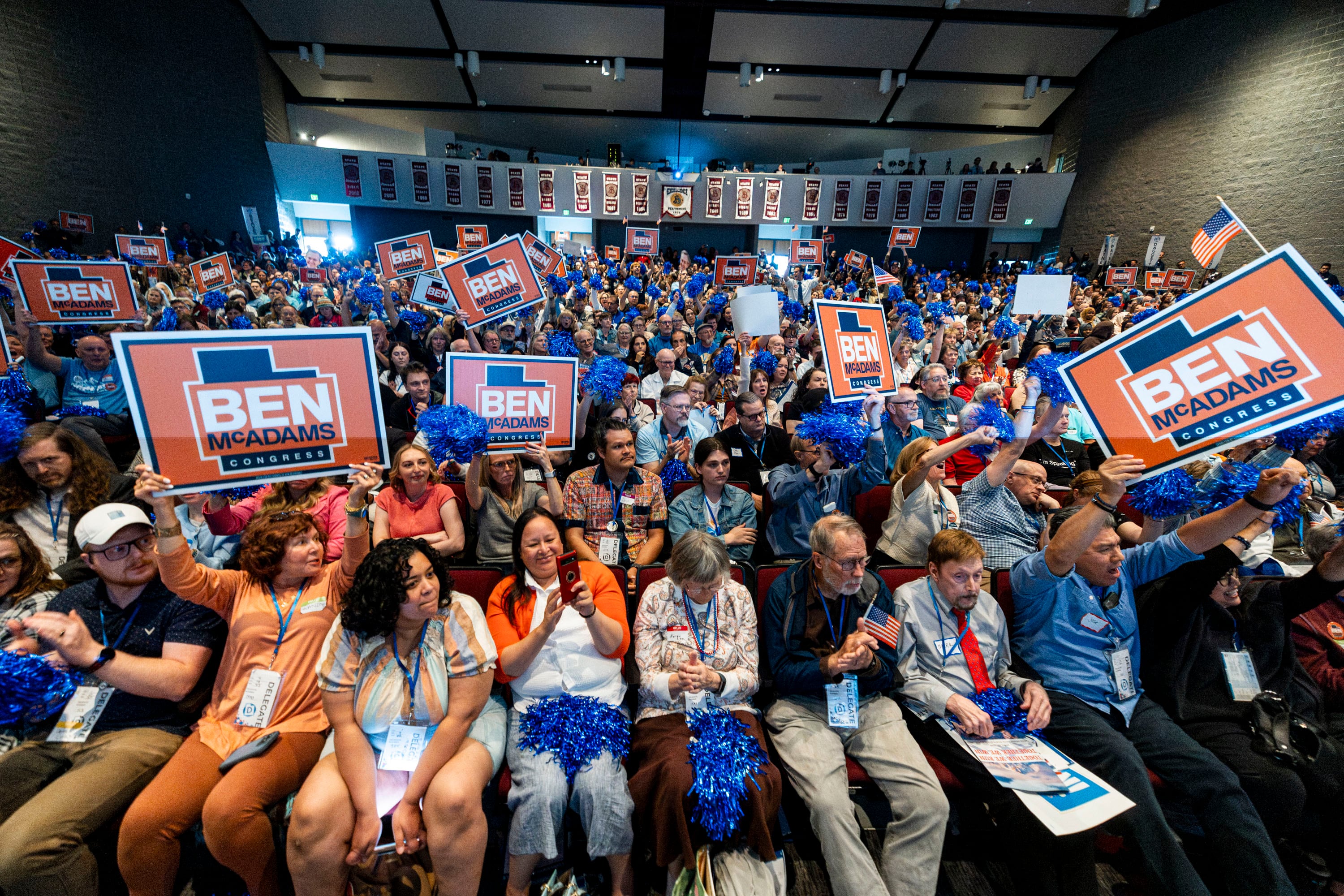 Supporters of Ben McAdams, a candidate for Utah's 1st Congressional District, hold signs as McAdams speaks during the Utah Democratic Party State Convention held at Jordan High School in Sandy on April 25.