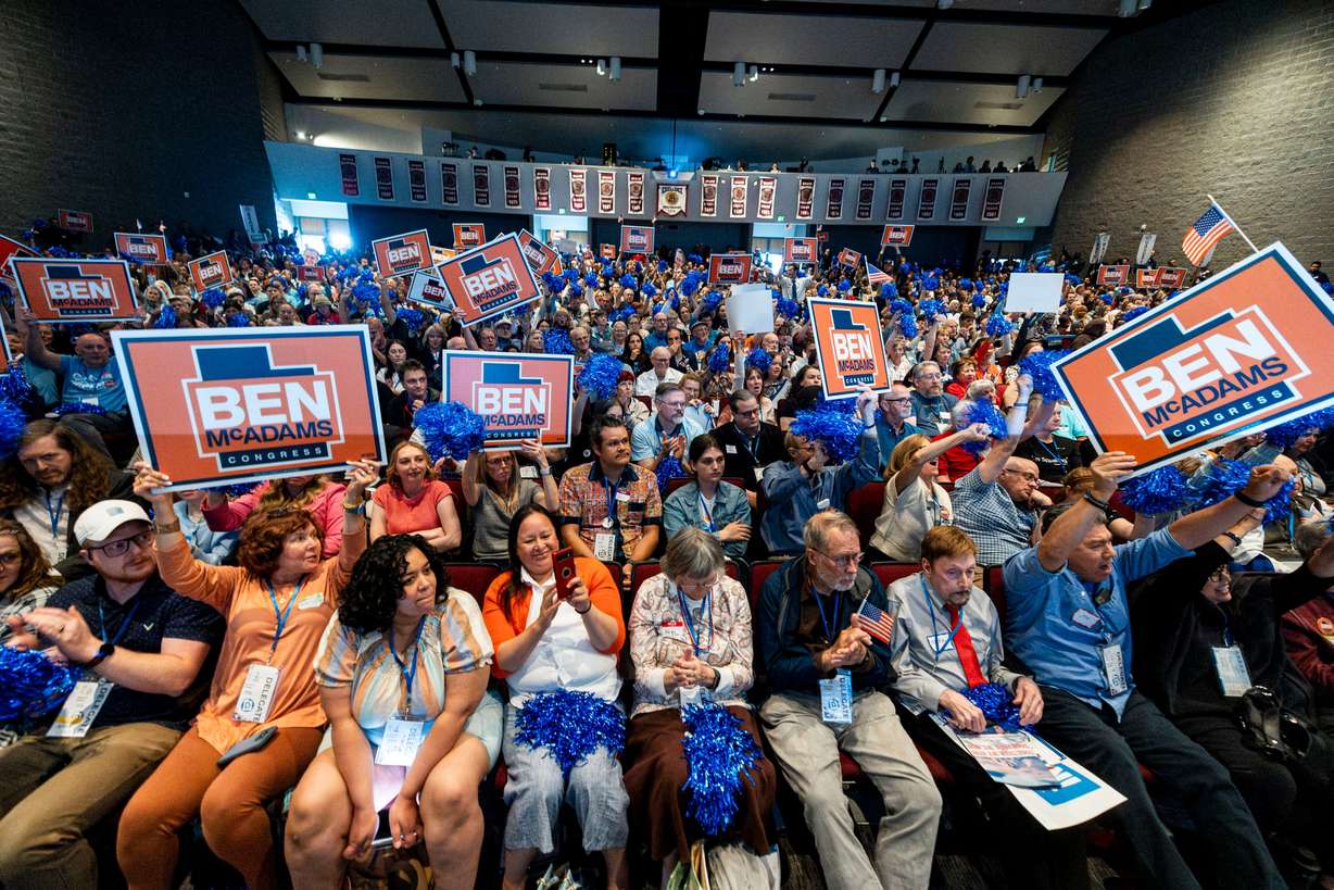 Supporters of Ben McAdams, a candidate for Utah's 1st Congressional District, hold signs as McAdams speaks during the Utah Democratic Party State Convention held at Jordan High School in Sandy on April 25.