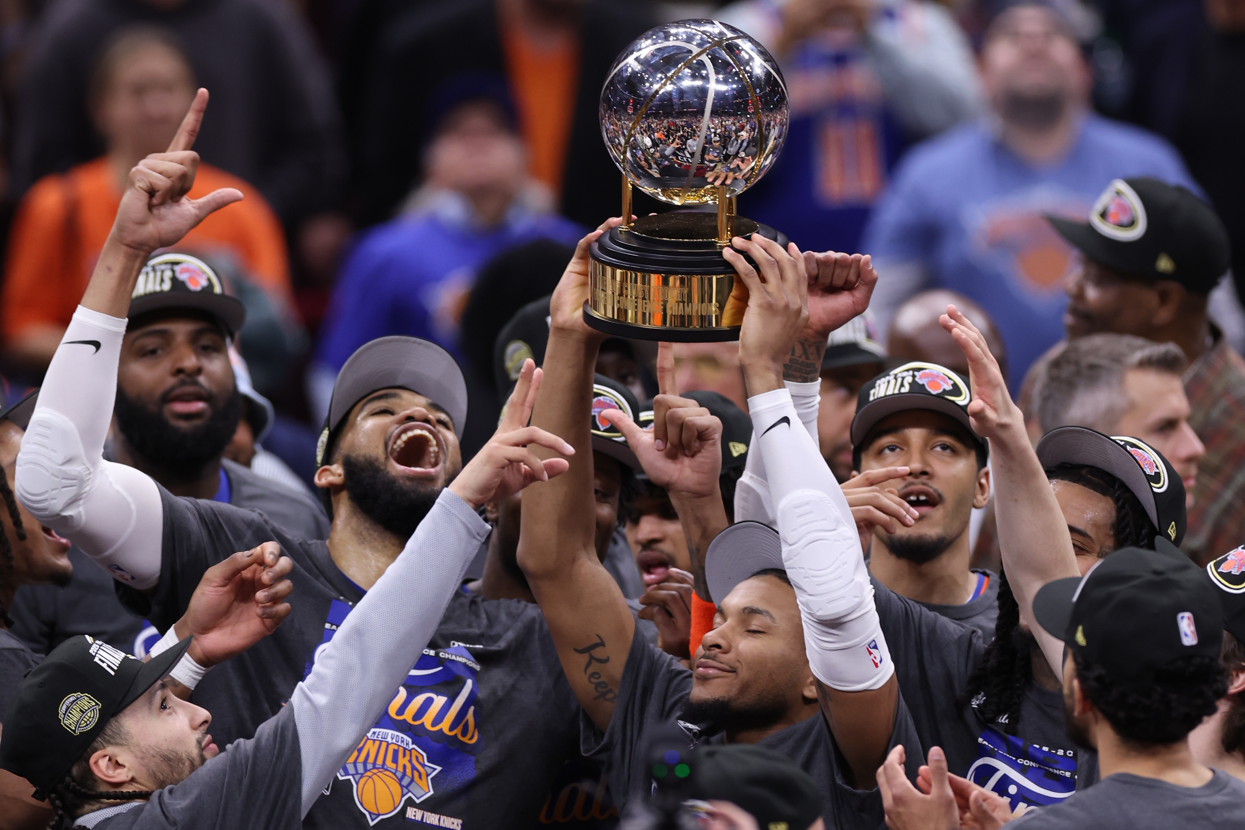 The New York Knicks hold the Eastern Conference Championship trophy after Game 4 in the Eastern Conference finals NBA basketball playoffs series against the Cleveland Cavaliers in Cleveland, Monday, May 25, 2026. 