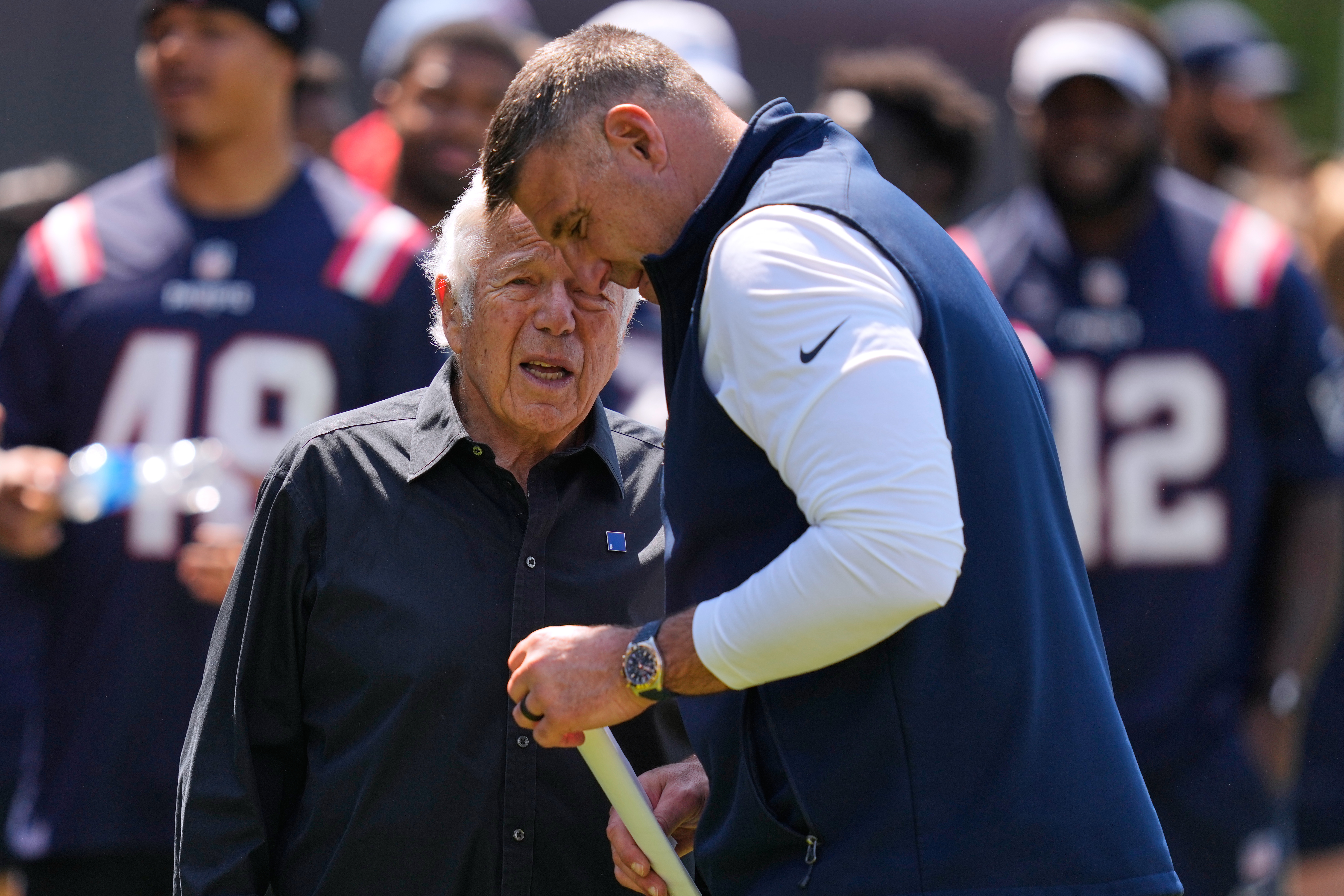 New England Patriots owner Robert Kraft talks with head coach Mike Vrabel during a community NFL football day, Wednesday, May 20, 2026, in Foxborough, Mass. 