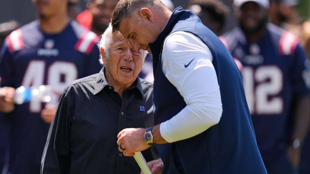 New England Patriots owner Robert Kraft talks with head coach Mike Vrabel during a community NFL football day, Wednesday, May 20, 2026, in Foxborough, Mass.