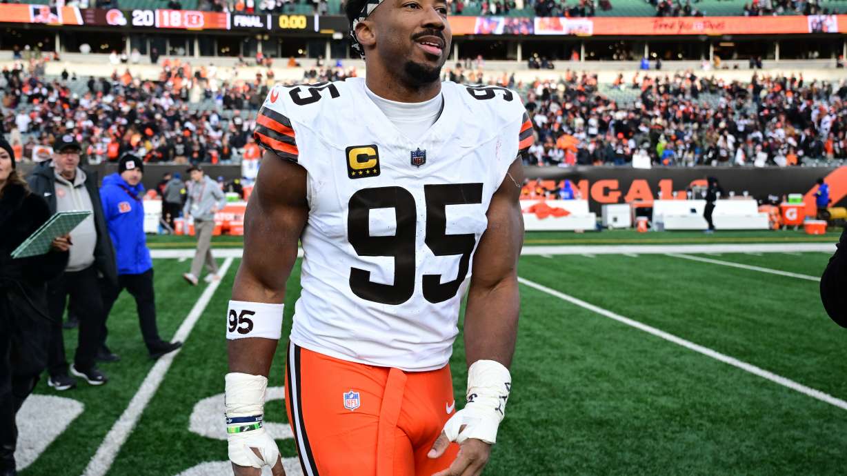 FILE - Cleveland Browns defensive end Myles Garrett celebrates with fans after an NFL football game against the Cincinnati Bengals in Cincinnati, Jan. 4, 2026.