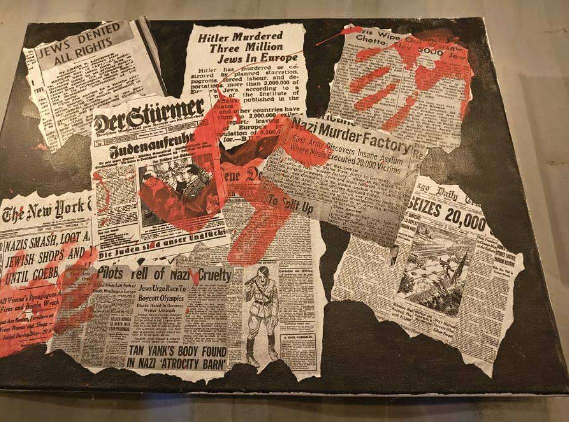 Newspaper clippings related to the Holocaust and World War II on display at Rigby High School in Rigby.
