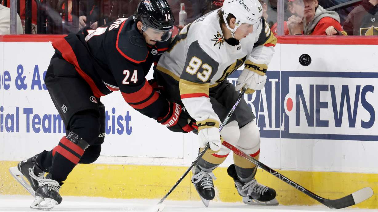 FILE - Carolina Hurricanes center Seth Jarvis (24) and Vegas Golden Knights right wing Mitch Marner (93) go for the puck during the first period of an NHL hockey game, Oct. 28, 2025, in Raleigh, N.C.
