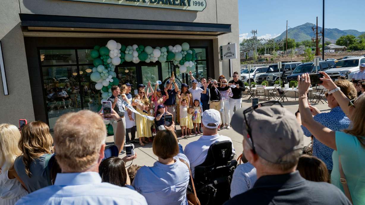 The ribbon is cut and those in attendance cheer as Magnolia Bakery opens in Holladay on Monday. Magnolia Bakery made its big debut in Holladay this week to a large crowd and a long line.