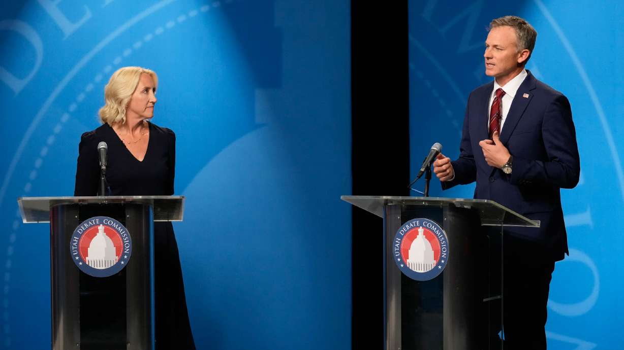 Candidates Karianne Lisonbee and Blake Moore participate in the 2nd Congressional District GOP primary debate in Salt Lake City on Monday.