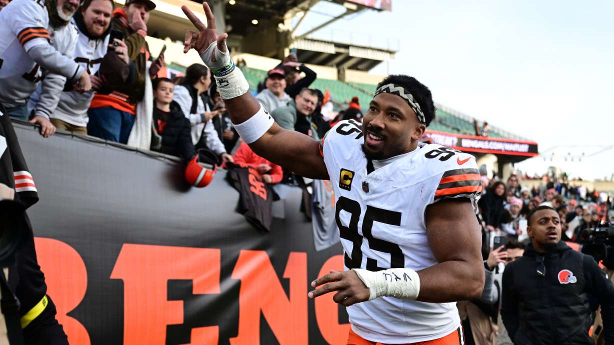 FILE - Cleveland Browns defensive end Myles Garrett celebrates with fans after an NFL football game against the Cincinnati Bengals in Cincinnati, Jan. 4, 2026.
