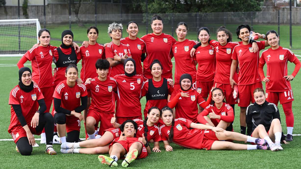 Afghan women's players pose for a team photo during a training session in Auckland, New Zealand, Tuesday, June 2, 2026.