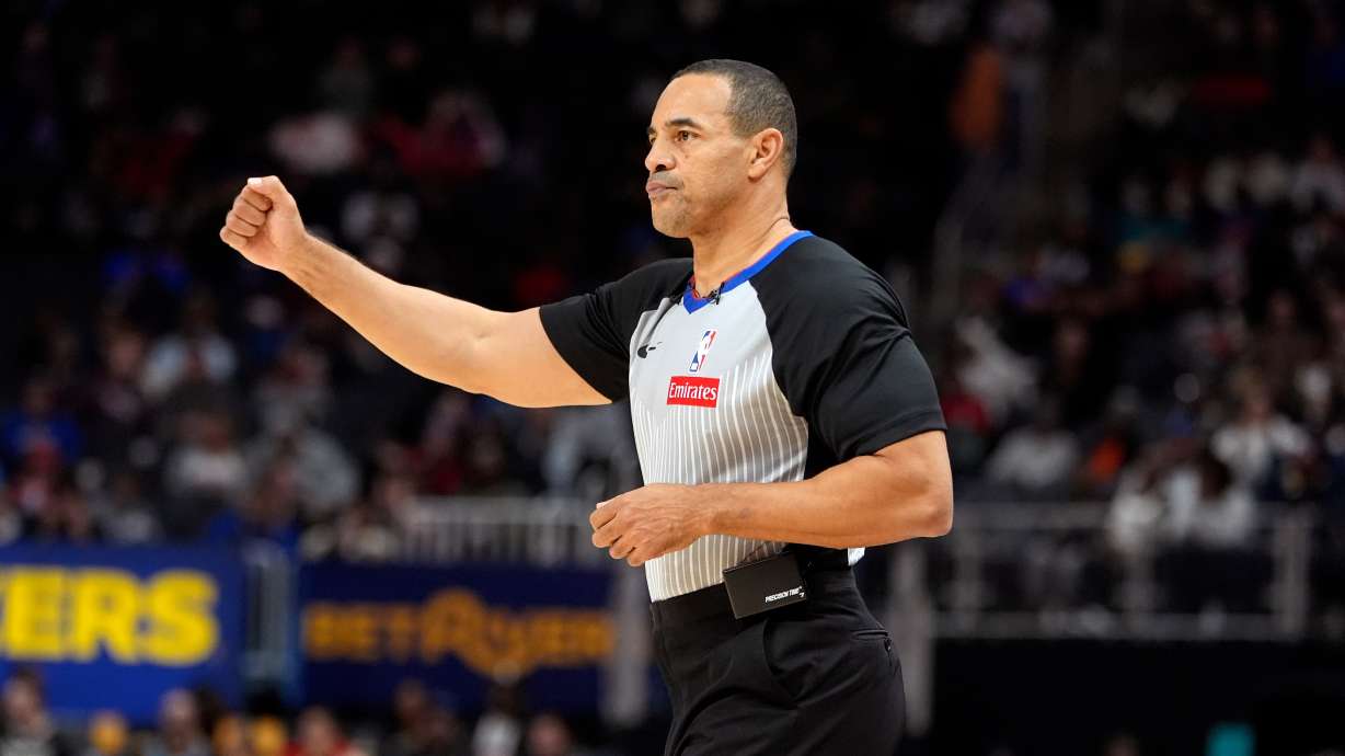 FILE - Referee Curtis Blair signals during the second half of an NBA basketball game between the Detroit Pistons and the Chicago Bulls, Nov. 18, 2024, in Detroit.