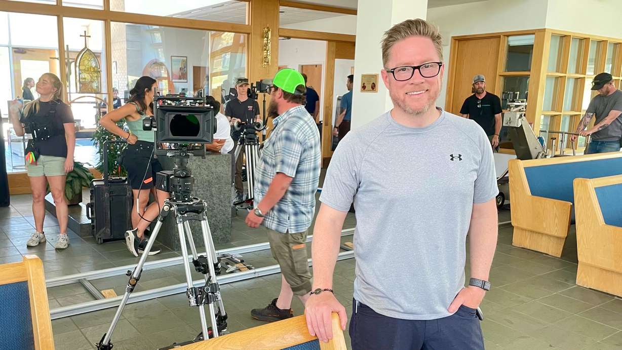 Utah filmmaker Ross Boothe is taking on the thorny immigration issue in a new musical, "Brotherhood." The May 12 photo shows Producer Daren Smith at St. Thomas More Catholic Church in Cottonwood Heights during preparation for a scene.