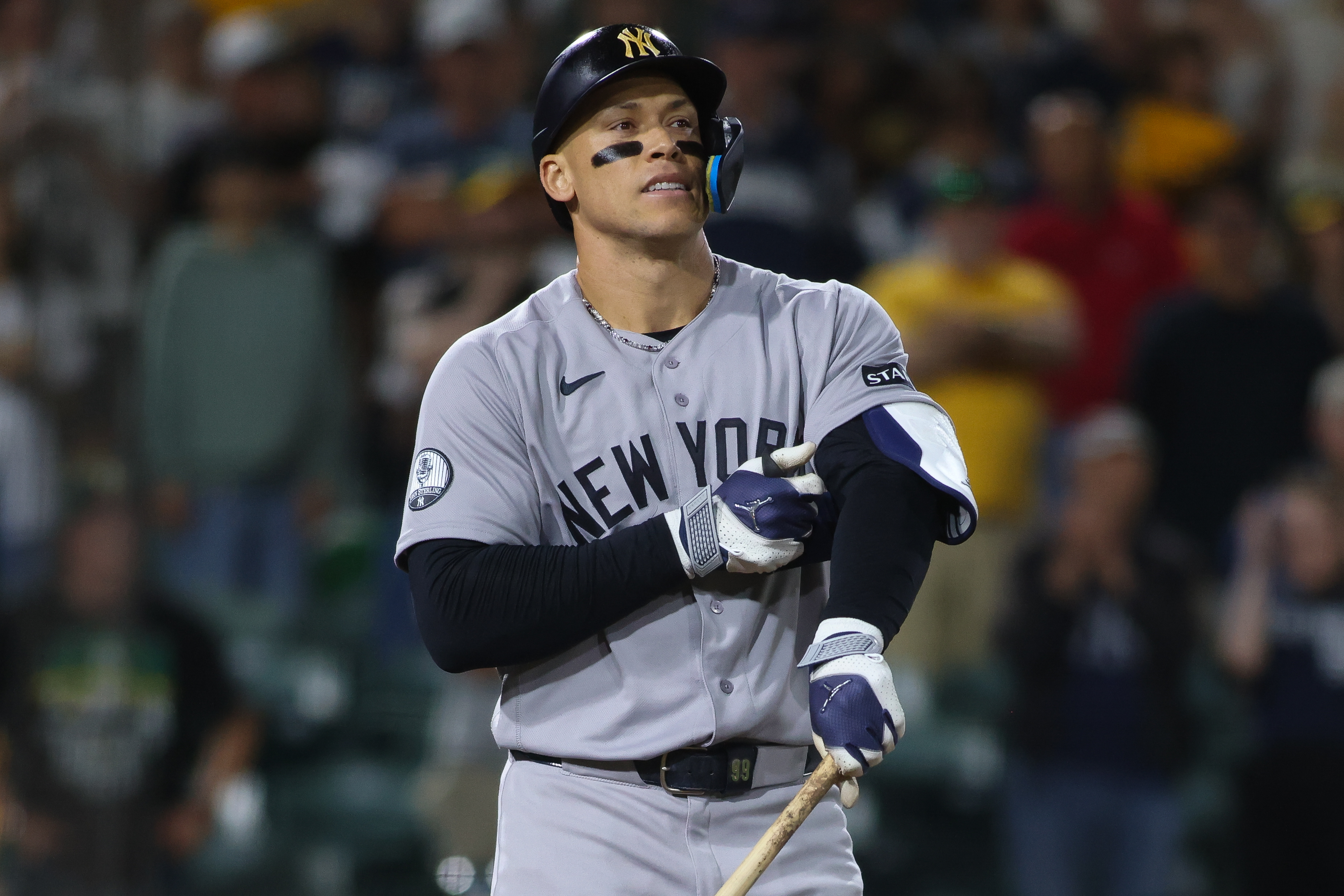 New York Yankees' Aaron Judge reacts after drawing a bases loaded walk to score a run during the ninth inning of a baseball game against the Athletics Saturday, May 30, 2026, in West Sacramento, Calif. 