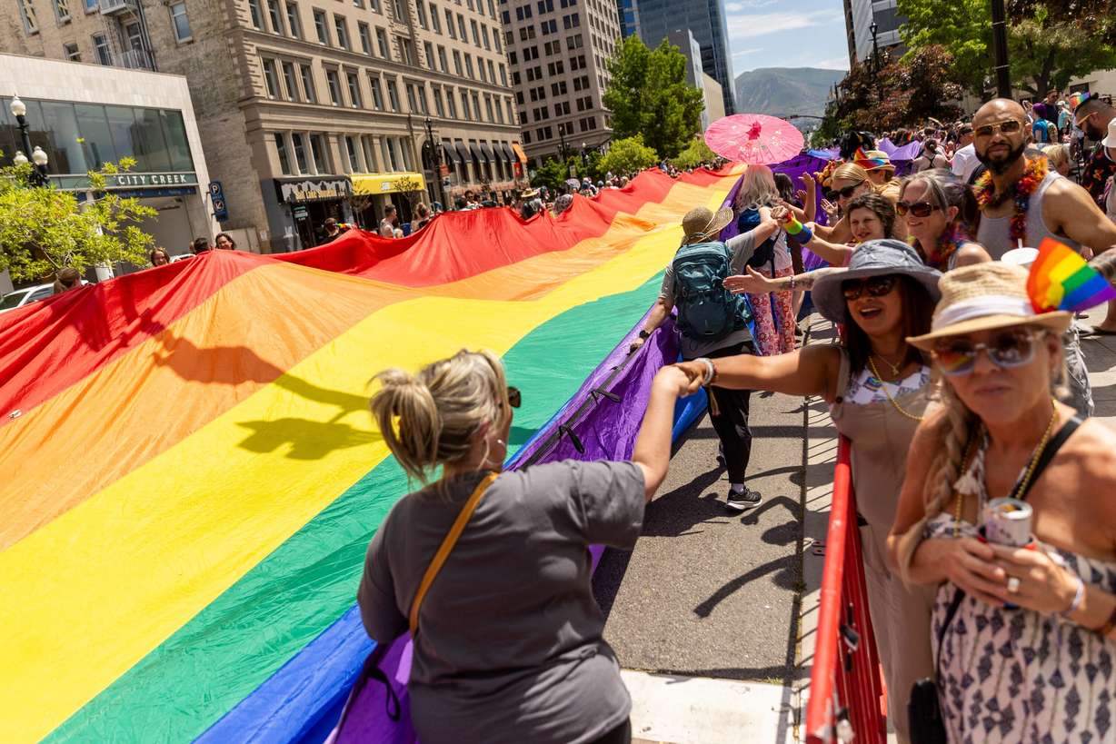 Utahns gather to celebrate Pride Month during the Pride Parade as it passes through downtown in Salt Lake City on June 2, 2024.