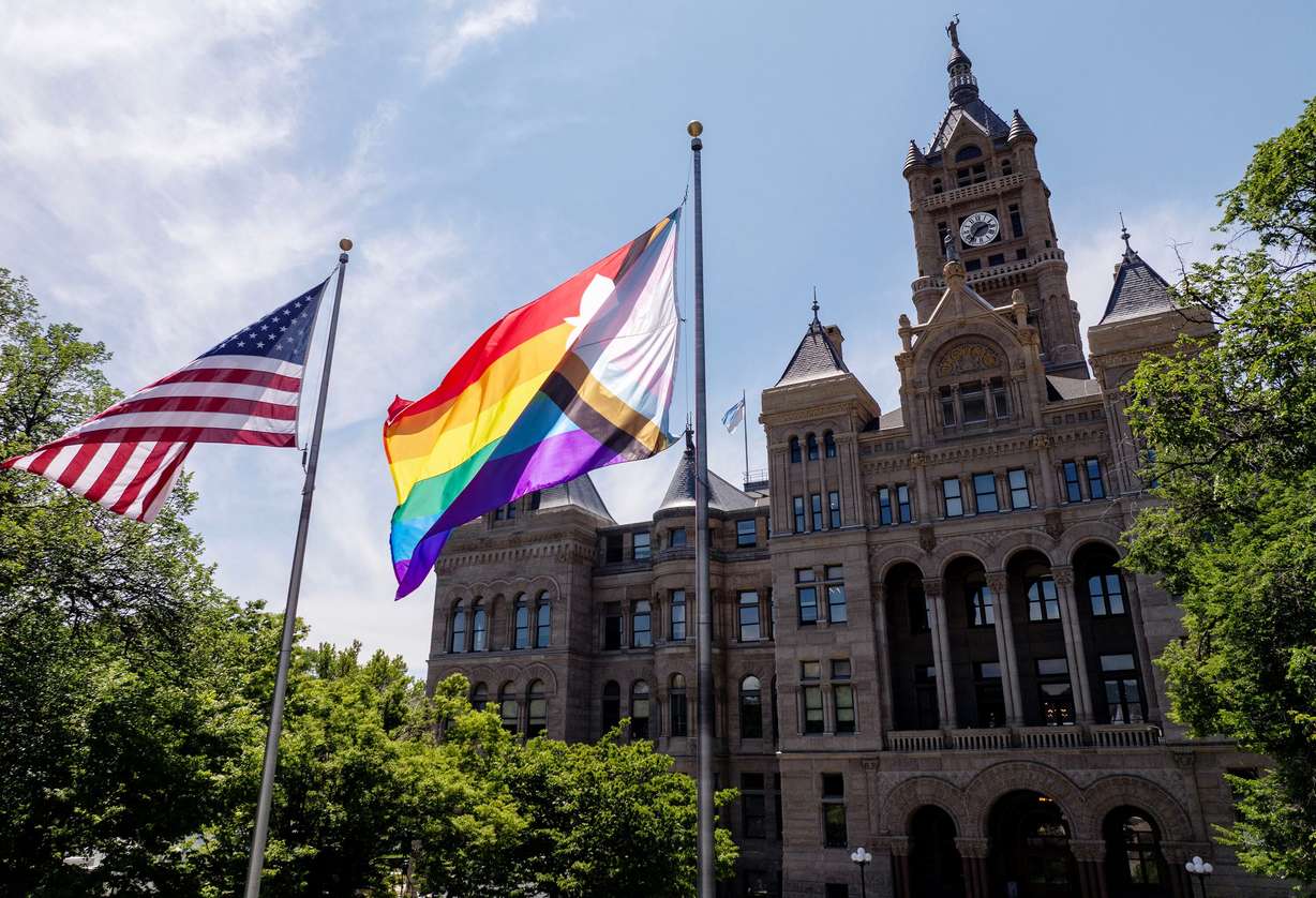 The American flag and a Pride flag fly outside the City and County Building in Salt Lake City on June 4, 2025.