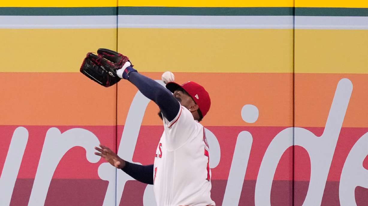 Los Angeles Angels right fielder Jo Adell misplays a ball hit by Colorado Rockies' TJ Rumfield that hit him in the head and then bounced out for a solo home run during the fourth inning of a baseball game Tuesday, June 2, 2026, in Anaheim, Calif.