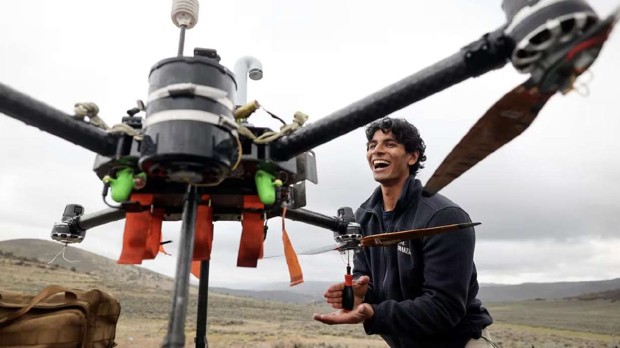 Ayan Maredia, Rainmaker forward deployed engineer, attaches propeller blades to a drone for a timed test run in Summit County on May 5.