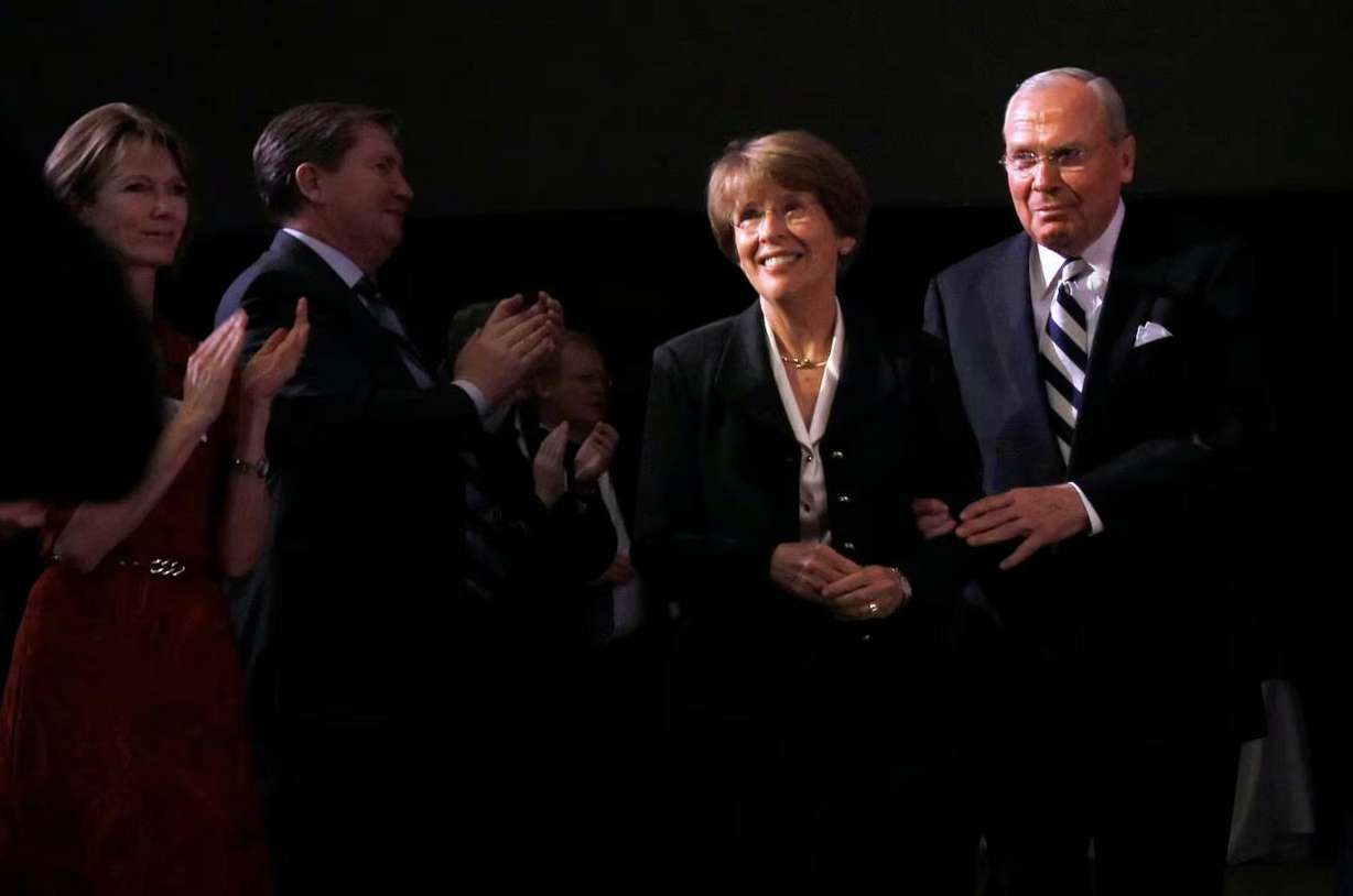 Jon M. Huntsman Sr. and wife Karen walk back to their seats during a luncheon to announce a donation of $26 million dollars to Utah State University for the Huntsman School of Business on Dec. 3, 2007.