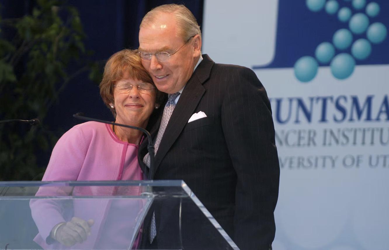 Karen Huntsman, left, embraces her husband Jon Huntsman Sr. following her remarks at the dedication of the new Huntsman Cancer Institute in Salt Lake City on June 21, 2004.
