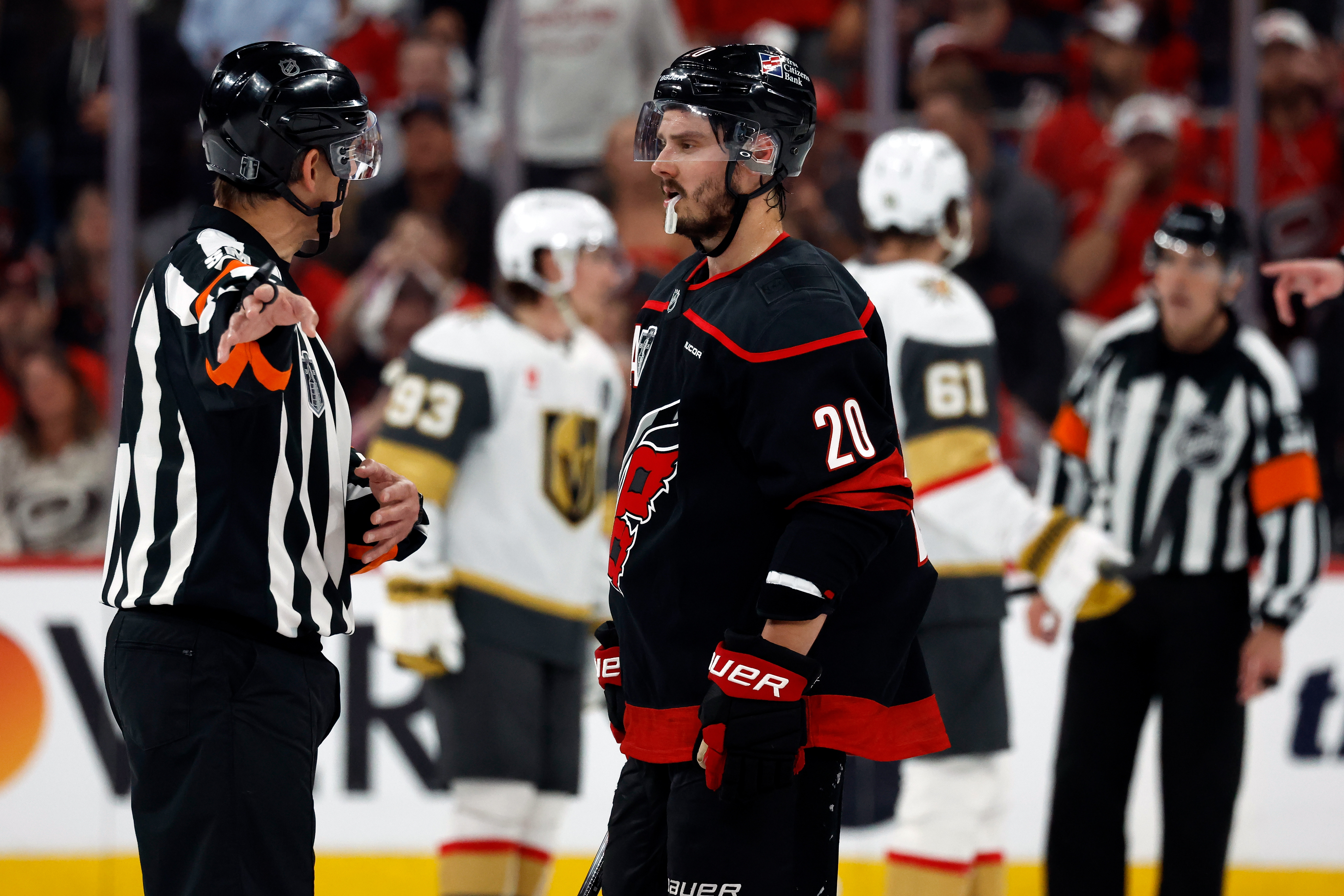 Carolina Hurricanes' Sebastian Aho (20) gets an explanation from an official during the second period in Game 1 of the NHL hockey Stanley Cup Final series against the Vegas Golden Knights in Raleigh, N.C., Tuesday, June 2, 2026. 