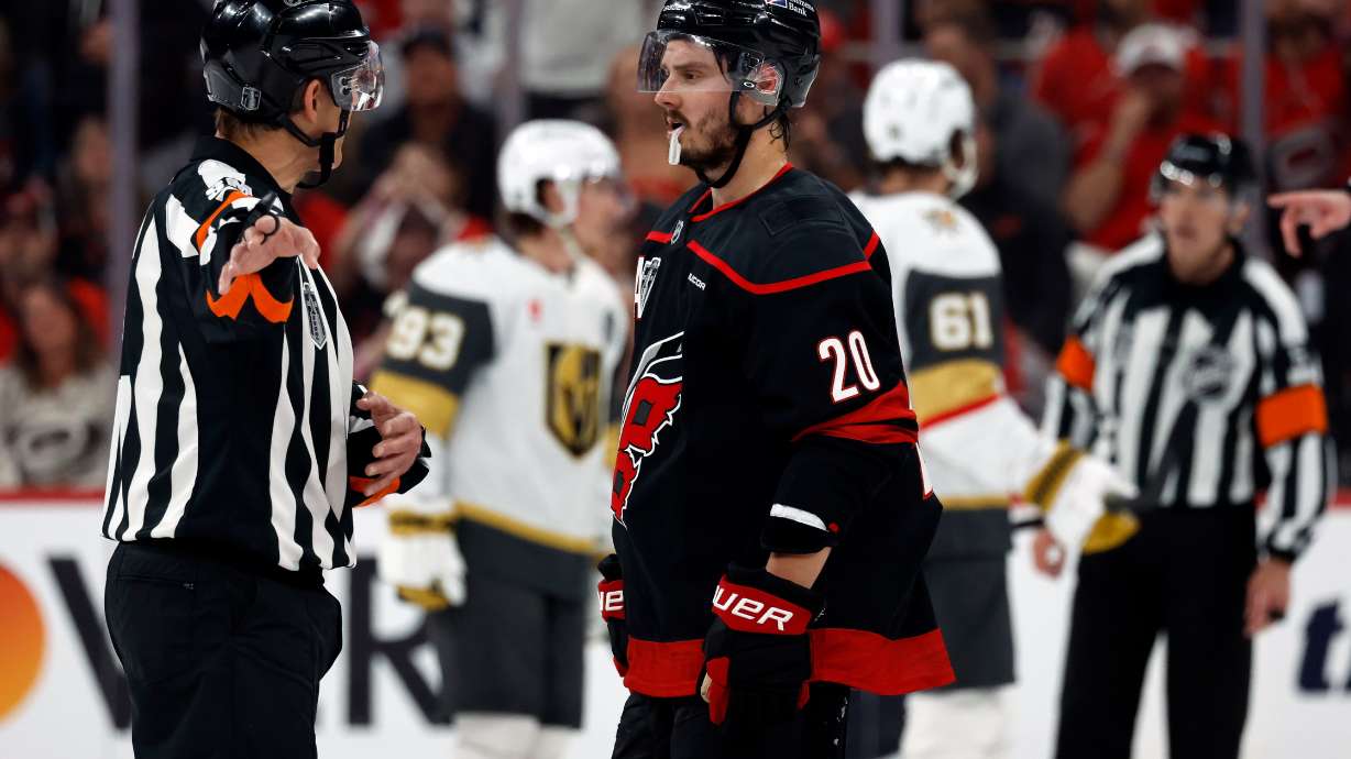Carolina Hurricanes' Sebastian Aho (20) gets an explanation from an official during the second period in Game 1 of the NHL hockey Stanley Cup Final series against the Vegas Golden Knights in Raleigh, N.C., Tuesday, June 2, 2026.