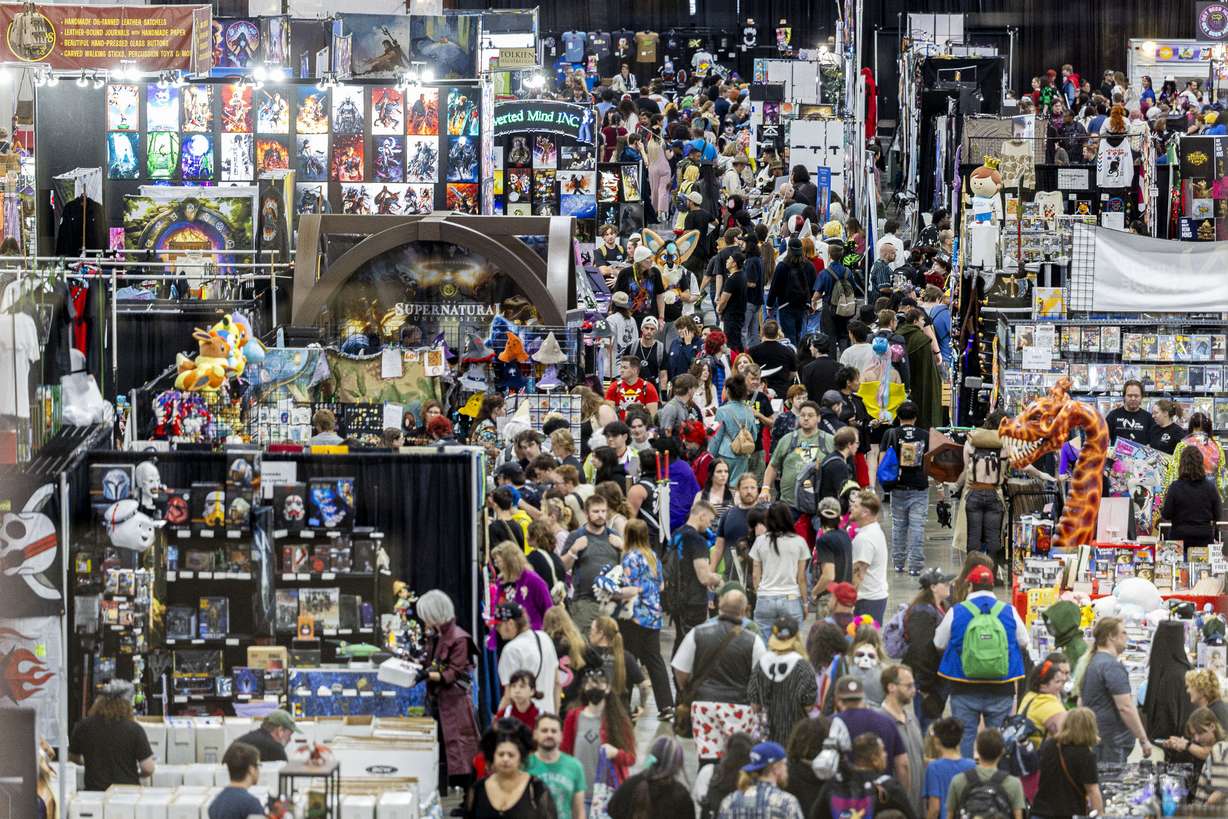 Attendees walk by vendor booths during the FanX Salt Lake Pop Culture and Comic Convention held at the Salt Palace Convention Center in Salt Lake City on Sept. 27, 2025.