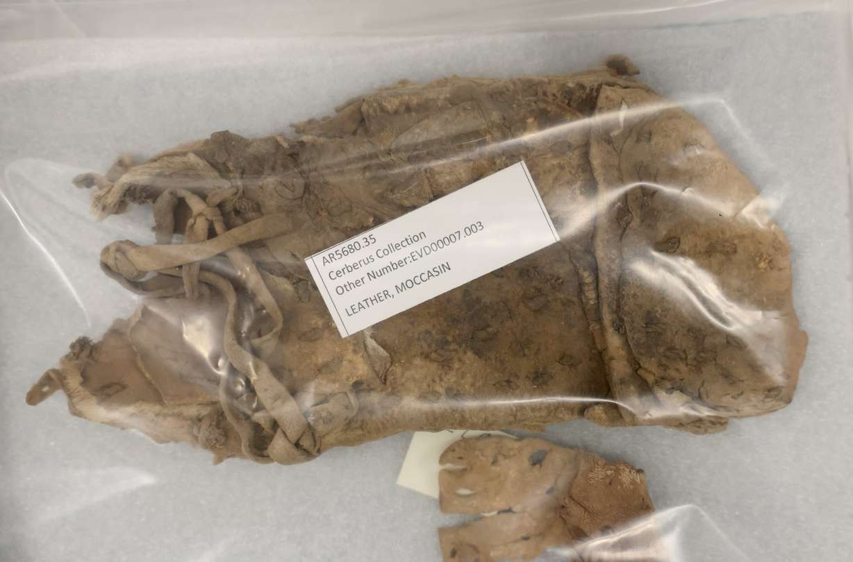 A leather moccasin that is part of the Cerberus Collection is pictured at the Natural History Museum of Utah in Salt Lake City on May 29. More than 100,000 Indigenous items were recovered in a federal undercover operation and the Utah Bureau of Land Management and NHMU are cataloging the artifacts and returning them to tribal nations when possible.