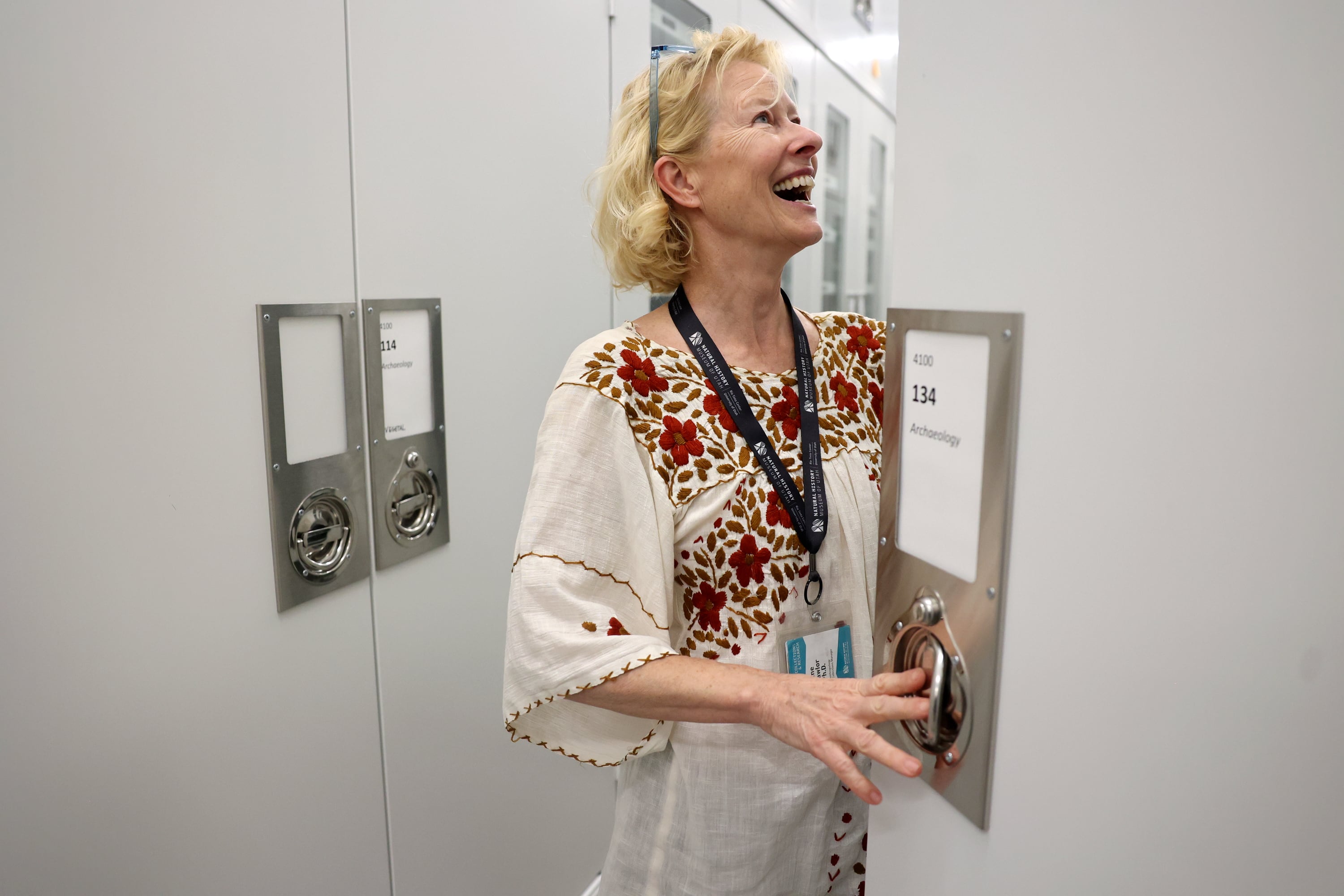 Anne Lawlor, Natural History Museum of Utah anthropology collections manager, looks for Indigenous items that are part of the Cerberus Project at the NHMU in Salt Lake City on May 29. More than 100,000 Indigenous items were recovered in a federal undercover operation and the Utah BLM and NHMU are cataloging the artifacts and returning them to tribal nations when possible.