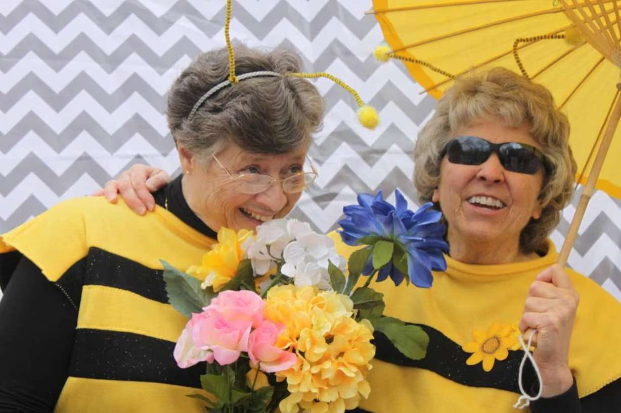 Sandra Rogers and Mary Ellen Edmunds pose for a photo in the bee costumes from their BYU Women's Conference etiquette video in this undated photo. Edmunds died on May 21 at the age of 86.