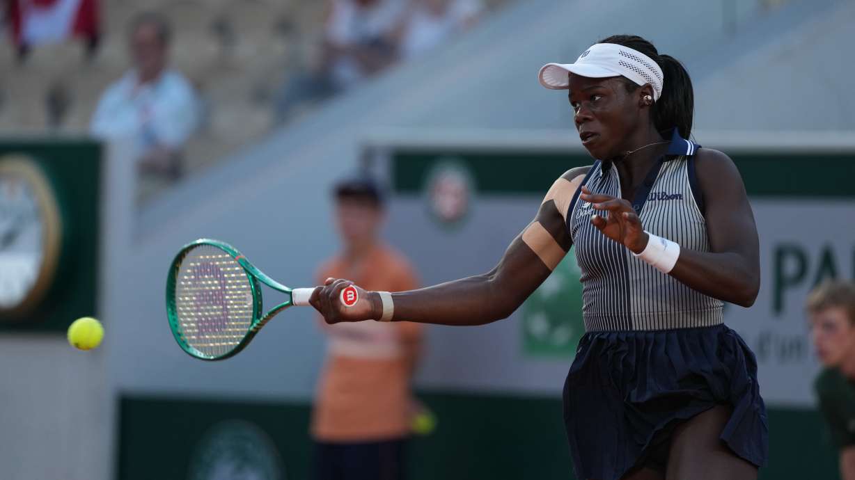 Victoria Mboko of Canada returns to Katerina Siniakova of the Czech Republic during their second round women's singles tennis match at the French Open tennis tournament in Paris, Thursday, May 28, 2026.