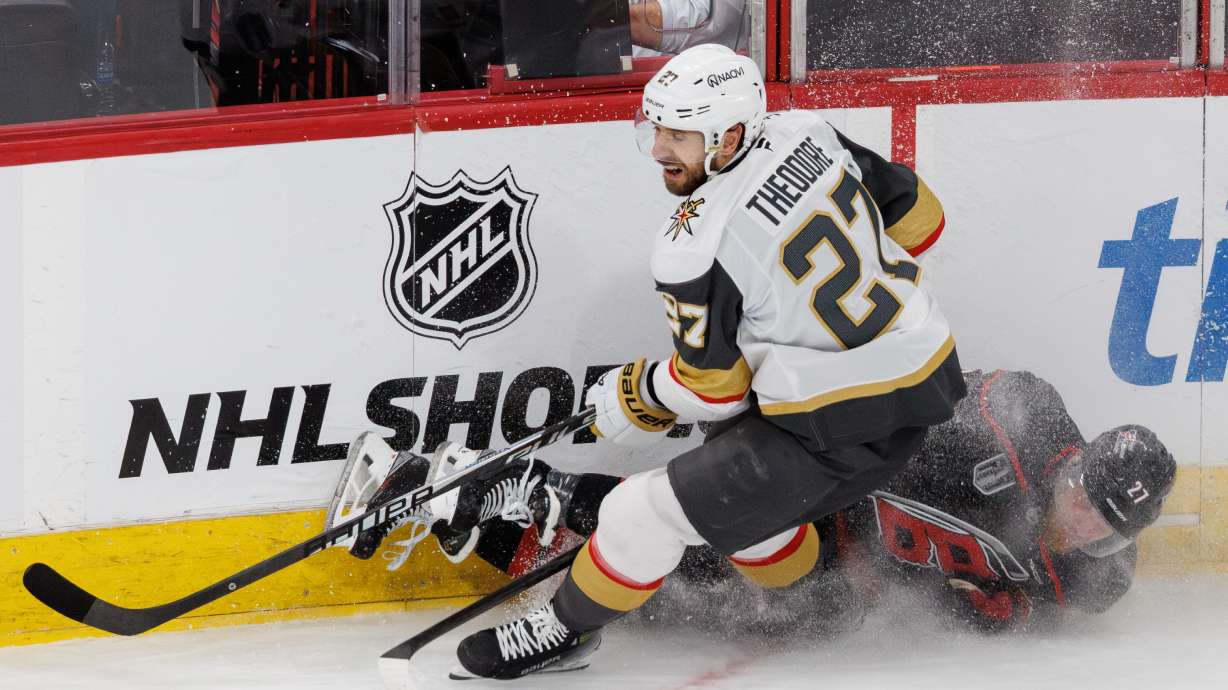 Vegas Golden Knights' Shea Theodore, left, and Carolina Hurricanes' Nikolaj Ehlers, right, collide during the second period in Game 1 of the NHL hockey Stanley Cup Final series in Raleigh, N.C., Tuesday, June 2, 2026.